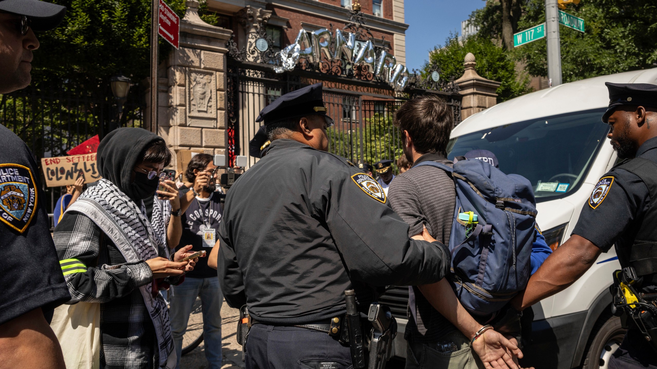 NYPD officers detain a pro-Palestinian supporter as they hold picket line outside Barnard College, Tuesday, Sept. 3, 2024, in New York. (AP Photo/Yuki Iwamura)