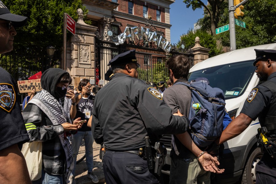 NYPD officers detain a pro-Palestinian supporter as they hold picket line outside Barnard College, Tuesday, Sept. 3, 2024, in New York. (AP Photo/Yuki Iwamura)