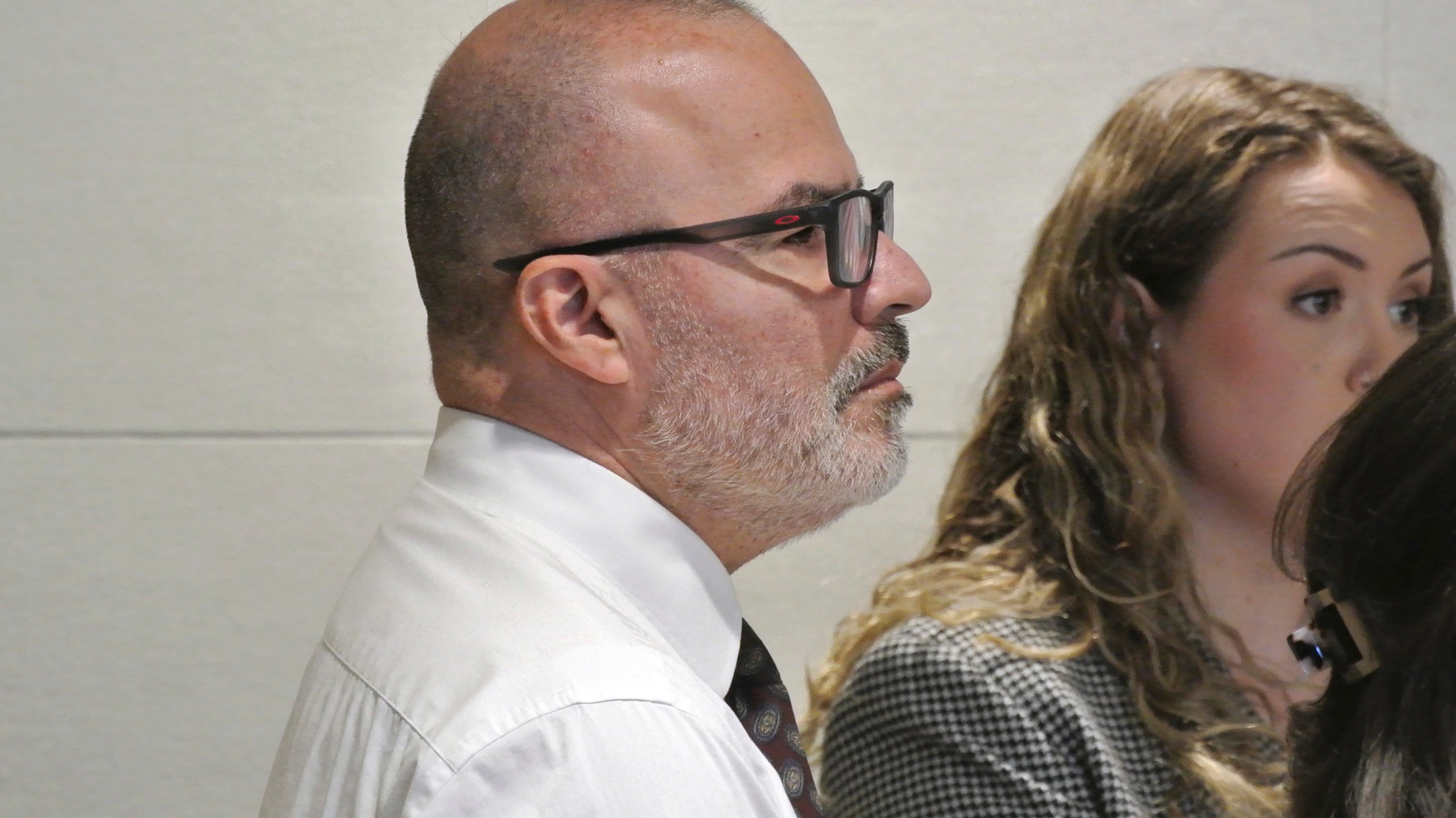 Victor Malavet, left, stands with defense attorney Zosia Buse, right, as the judge directs the jury to continue with deliberations before later declaring a mistrial, Tuesday, Sept. 3, 2024, at Merrimack County Superior Court, in Concord, N.H. (Damien Fisher/InDepthNH via AP, Pool)