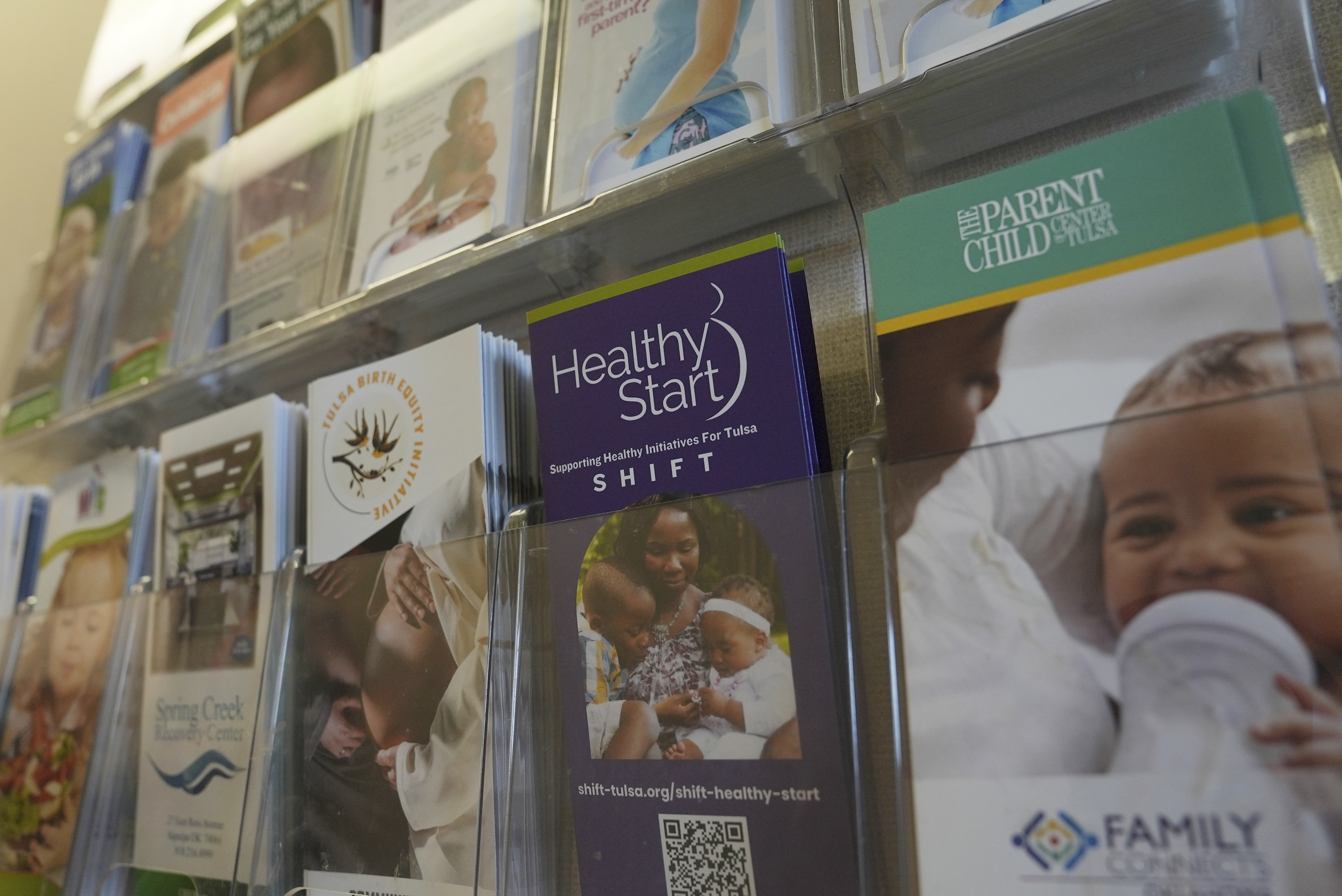 A Healthy Start pamphlet is displayed with others at the Oklahoma State University obstetrics and gynecology clinic in Tulsa, Okla., on Tuesday, July 16, 2024. (AP Photo/Mary Conlon)