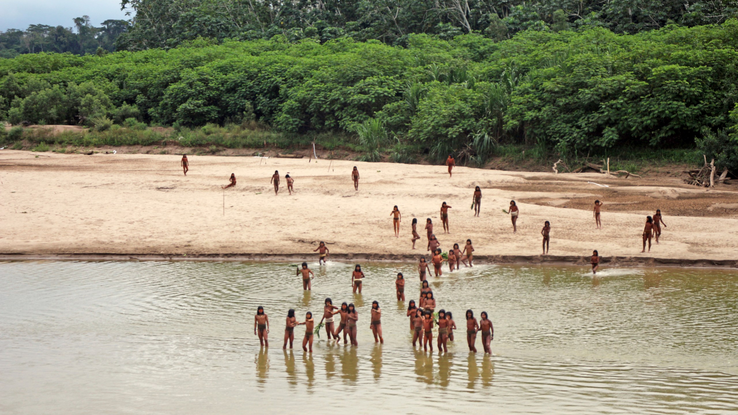 FILE - This June 2024 photo provided by Survival International shows members of the Mashco Piro along Las Piedras River in the Amazon near the community of Monte Salvado, in Madre de Dios province, Peru. (Survival International via AP, File)