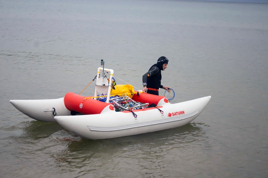 Jim Dreyer heads out into Lake Michigan in Grand Haven, Mich., Aug. 6, 2024, in his attempt to swim to Wisconsin. (Blace Carpenter/The Tribune via AP)