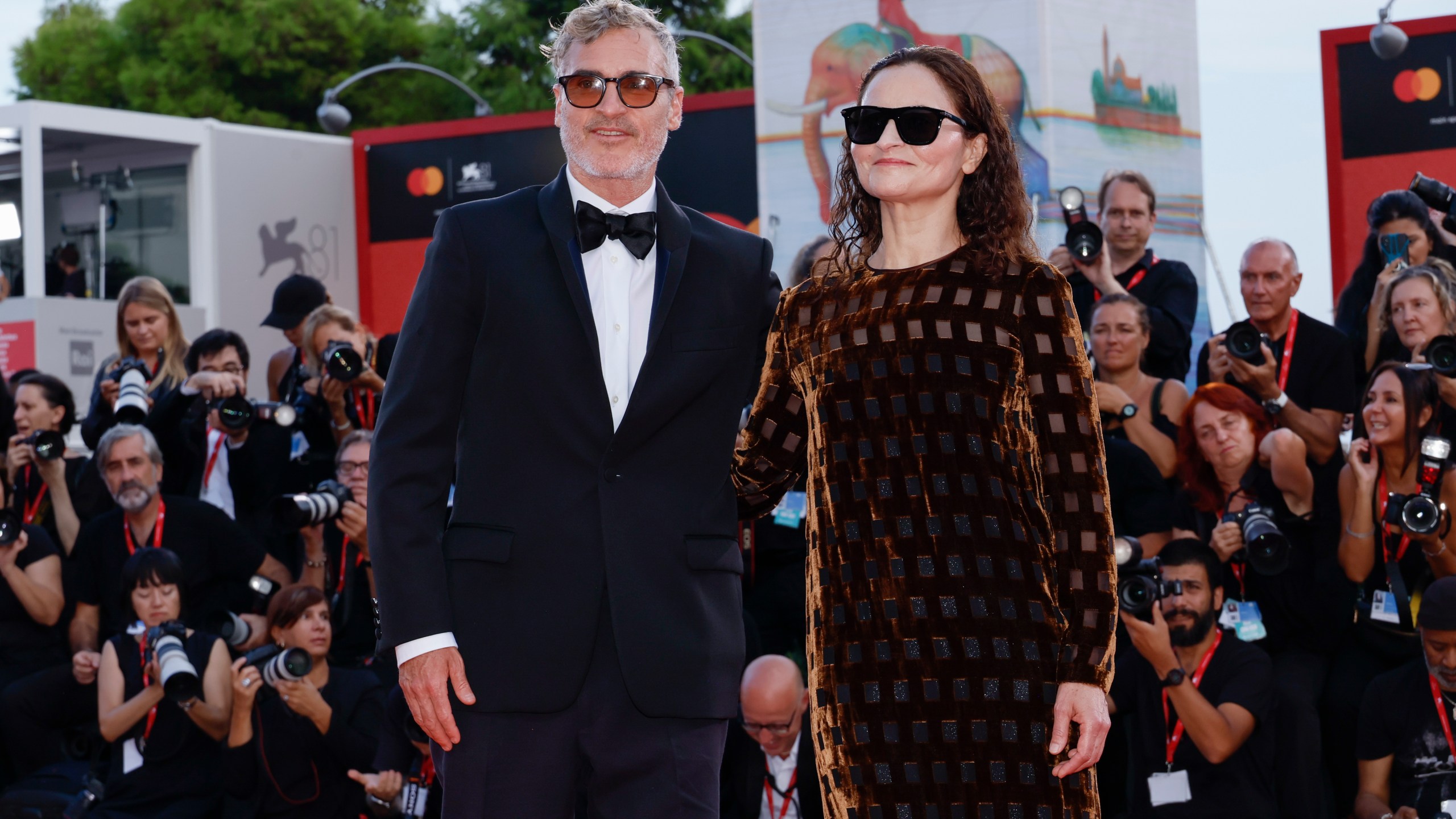 Joaquin Phoenix, left, and Rain Phoenix pose for photographers upon arrival for the premiere of the film 'Joker: Folie A Deux' during the 81st edition of the Venice Film Festival in Venice, Italy, on Wednesday, Sept. 4, 2024. (Photo by Joel C Ryan/Invision/AP)