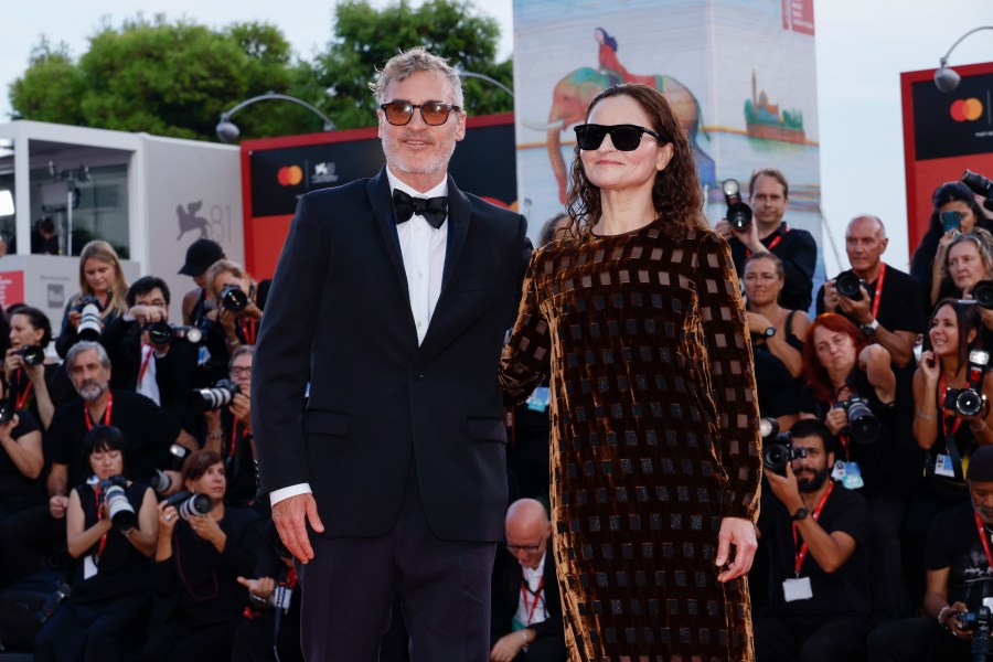 Joaquin Phoenix, left, and Rain Phoenix pose for photographers upon arrival for the premiere of the film 'Joker: Folie A Deux' during the 81st edition of the Venice Film Festival in Venice, Italy, on Wednesday, Sept. 4, 2024. (Photo by Joel C Ryan/Invision/AP)