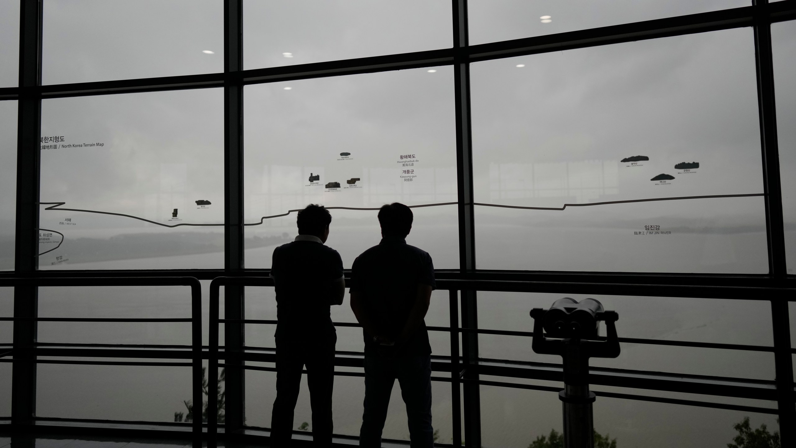 Visitors look at the North Korean side from the unification observatory in Paju, South Korea, Thursday, Sept. 5, 2024. (AP Photo/Lee Jin-man)