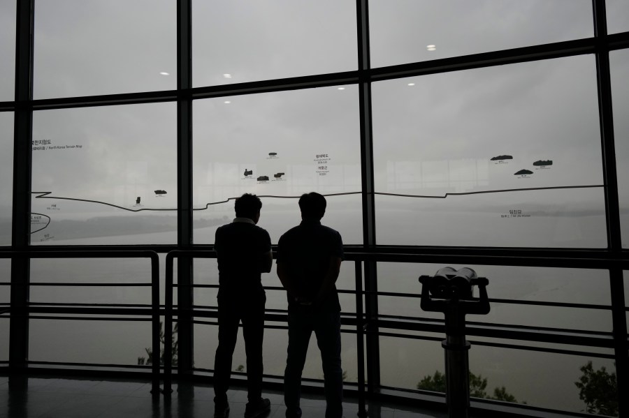 Visitors look at the North Korean side from the unification observatory in Paju, South Korea, Thursday, Sept. 5, 2024. (AP Photo/Lee Jin-man)