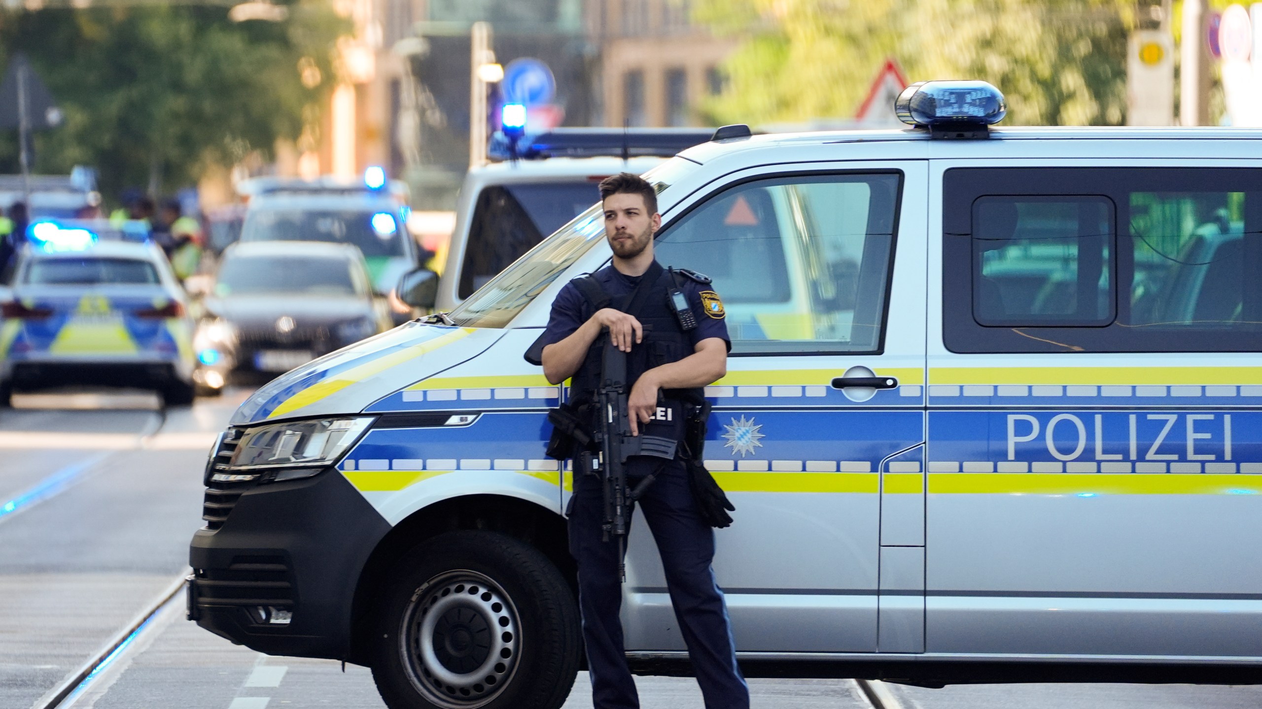 Police officer block a street after police fired shots at a suspicious person near the Israeli Consulate and a museum on the city's Nazi-era history in Munich, Germany, Thursday, Sept. 5, 2024. (AP Photo/Matthias Schrader)