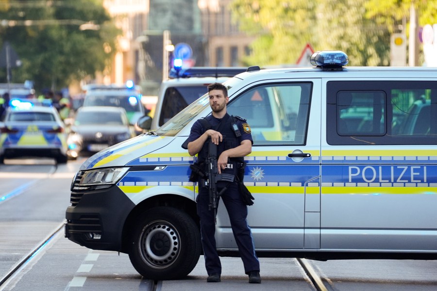 Police officer block a street after police fired shots at a suspicious person near the Israeli Consulate and a museum on the city's Nazi-era history in Munich, Germany, Thursday, Sept. 5, 2024. (AP Photo/Matthias Schrader)