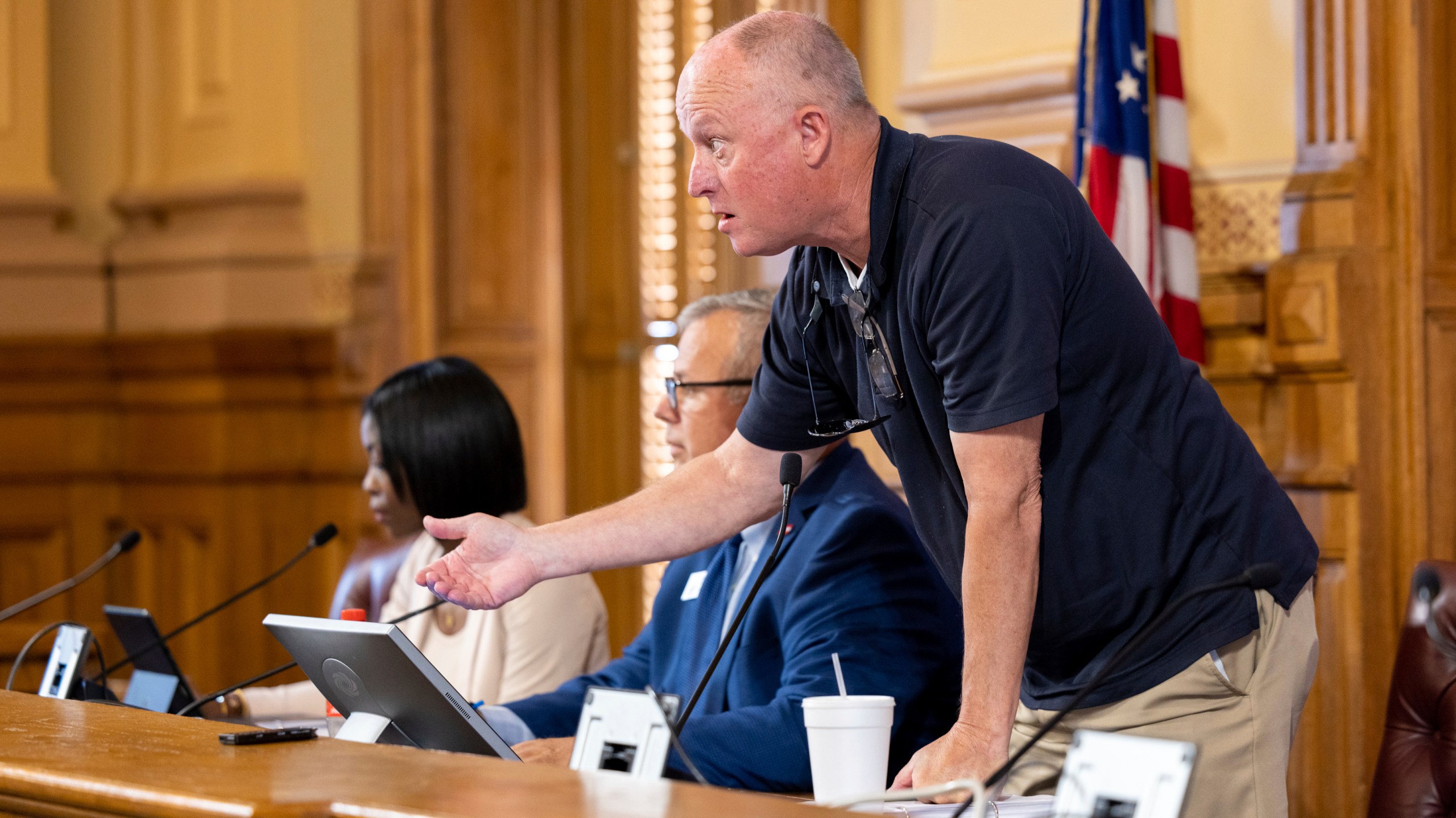 FILE - State Election Board member Rick Jeffares asks the crowd to settle down during a hastily planned State Election Board meeting at the Capitol in Atlanta, July 12, 2024. (Arvin Temkar/Atlanta Journal-Constitution via AP, File)/