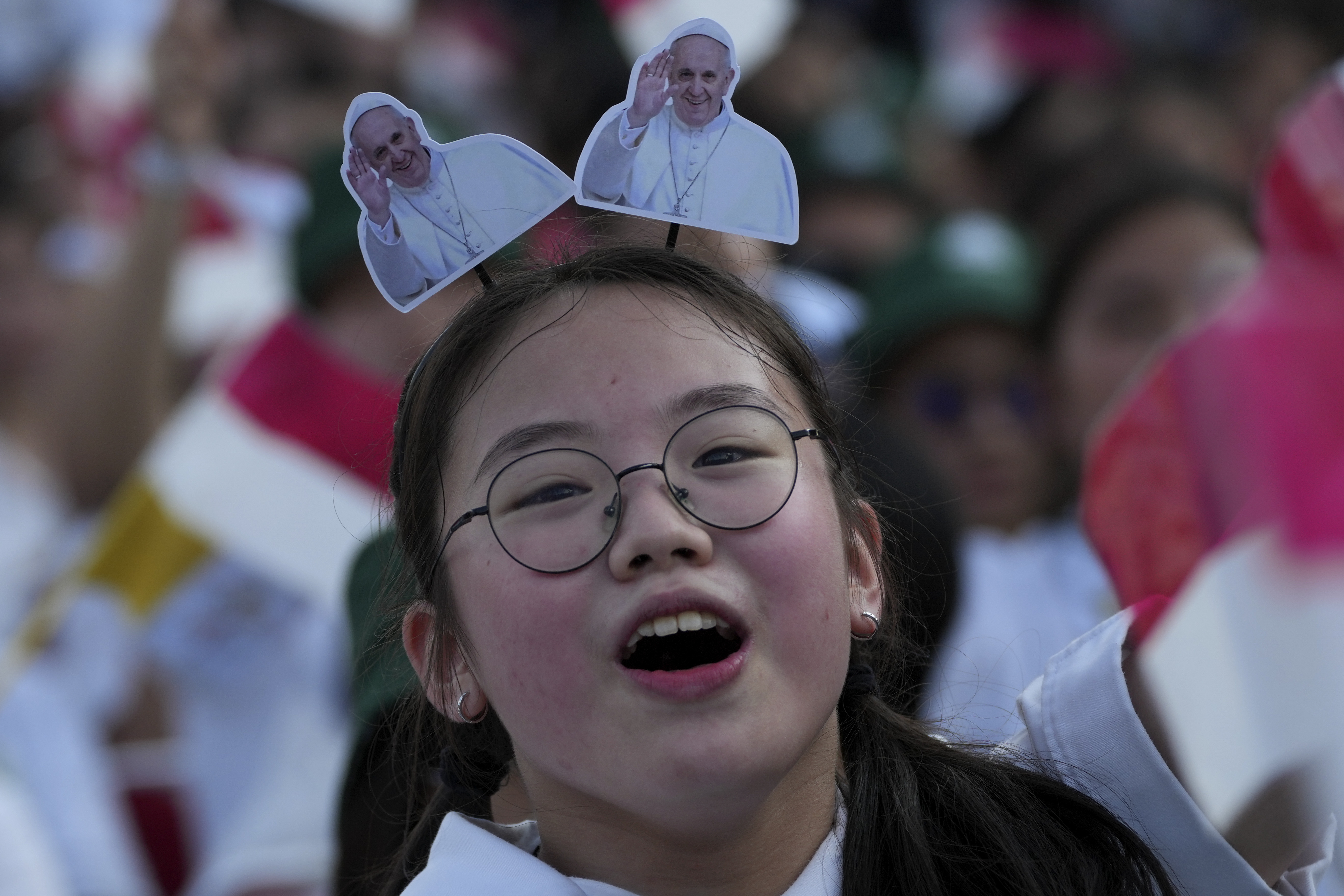 A girl reacts as Pope Francis arrives at Madya Stadium in Jakarta, Indonesia, Thursday, Sept. 5, 2024. (AP Photo/Tatan Syuflana)