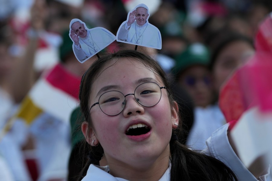 A girl reacts as Pope Francis arrives at Madya Stadium in Jakarta, Indonesia, Thursday, Sept. 5, 2024. (AP Photo/Tatan Syuflana)