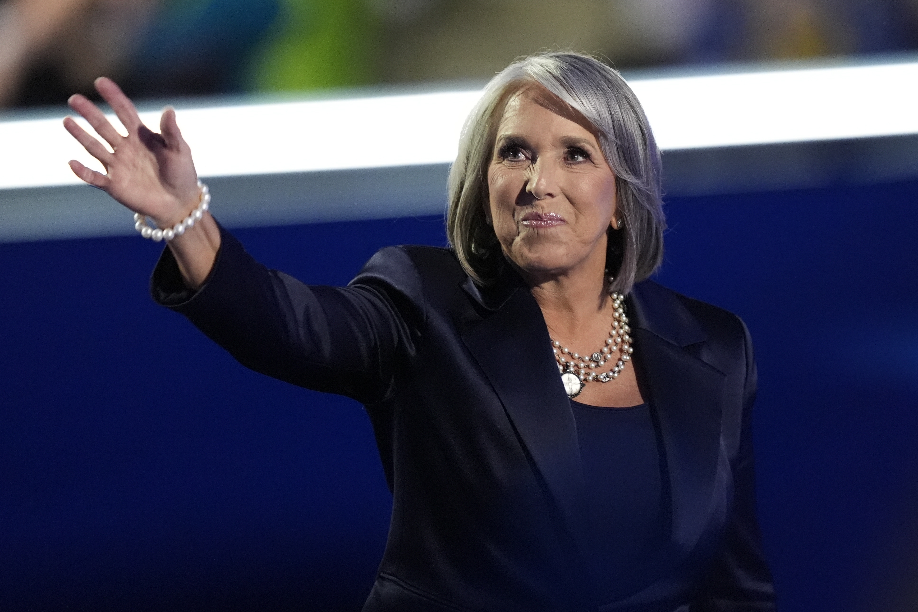 New Mexico Gov. Michelle Lujan Grisham waves during the Democratic National Convention Tuesday, Aug. 20, 2024, in Chicago. (AP Photo/Charles Rex Arbogast)