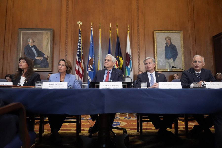 Attorney General Merrick Garland, center, speaks before a meeting of the Justice Department's Election Threats Task Force, at the Department of Justice, Wednesday, Sept. 4, 2024, in Washington, with from left, Deputy Attorney General, Criminal Division, Nicole Argentieri, Deputy Attorney General Lisa Monaco, Garland, FBI Director Christopher Wray and Assistant Attorney General, National Security Division, Matthew Olsen. (AP Photo/Mark Schiefelbein)