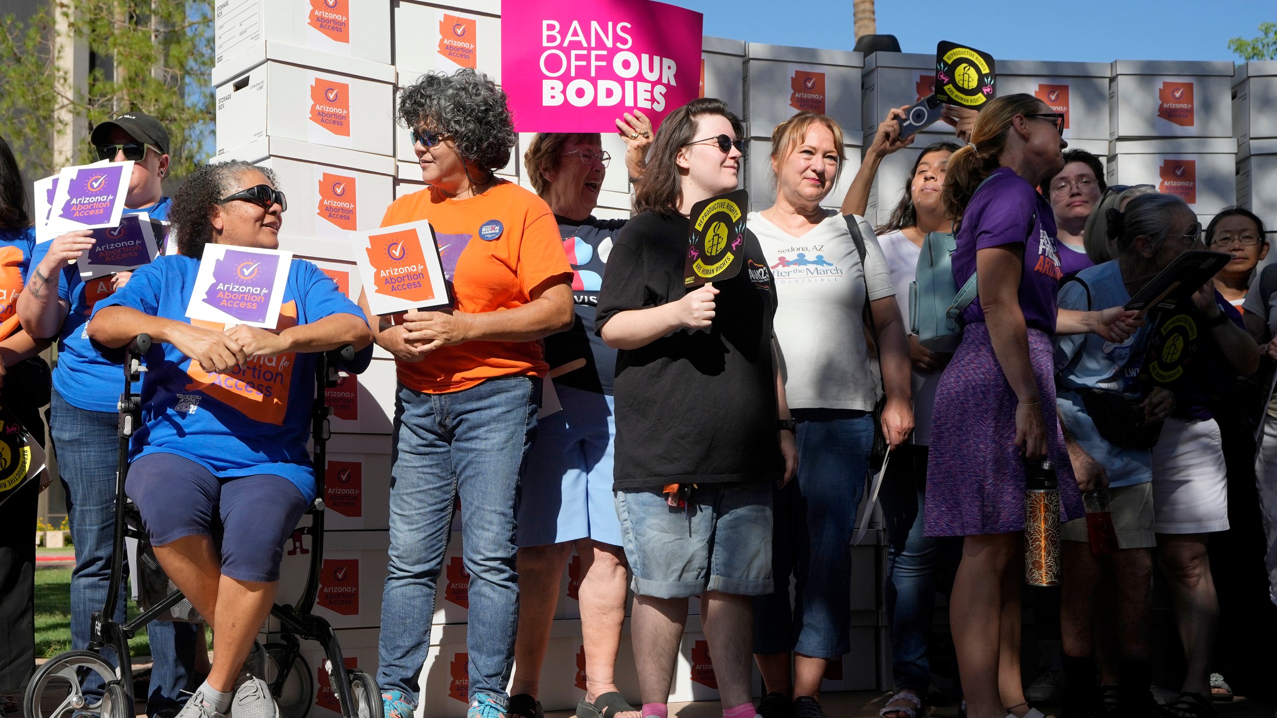 FILE - Arizona abortion-rights supporters gather for a news conference prior to delivering over 800,000 petition signatures to the capitol to get abortion rights on the November general election ballot, July 3, 2024, in Phoenix. (AP Photo/Ross D. Franklin, File)