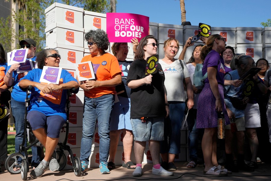 FILE - Arizona abortion-rights supporters gather for a news conference prior to delivering over 800,000 petition signatures to the capitol to get abortion rights on the November general election ballot, July 3, 2024, in Phoenix. (AP Photo/Ross D. Franklin, File)