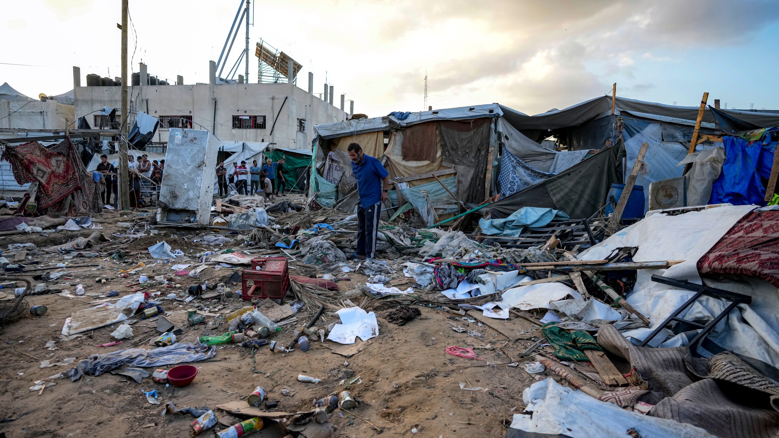 Palestinians inspect the damage at a tent area in the courtyard of Al Aqsa Martyrs hospital, hit by an Israeli bombardment on Deir al-Balah, central Gaza Strip, Thursday, Sept. 5, 2024. (AP Photo/Abdel Kareem Hana)