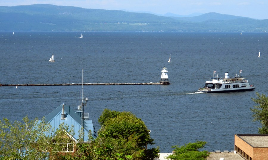 FILE - Sailboats and a passenger ferry dot Lake Champlain as seen from Battery Park, Aug. 14, 2015 in Burlington, Vt. (AP Photo/Wilson Ring, File)