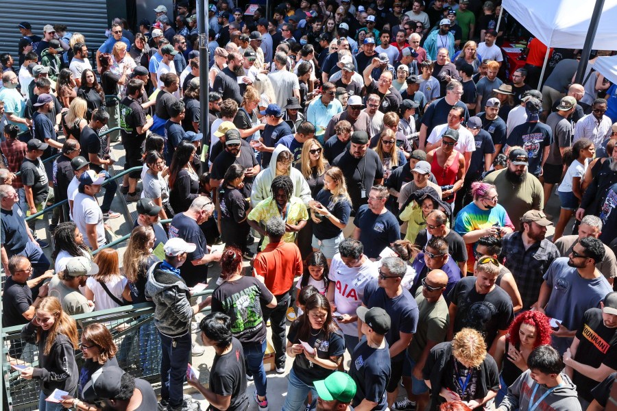 FILE - Thousands of Boeing machinists make their way to the exits to cast their vote after the "stop work meeting" and strike sanction at T-Mobile Park in Seattle, July 17, 2024. (Kevin Clark/The Seattle Times via AP, File)