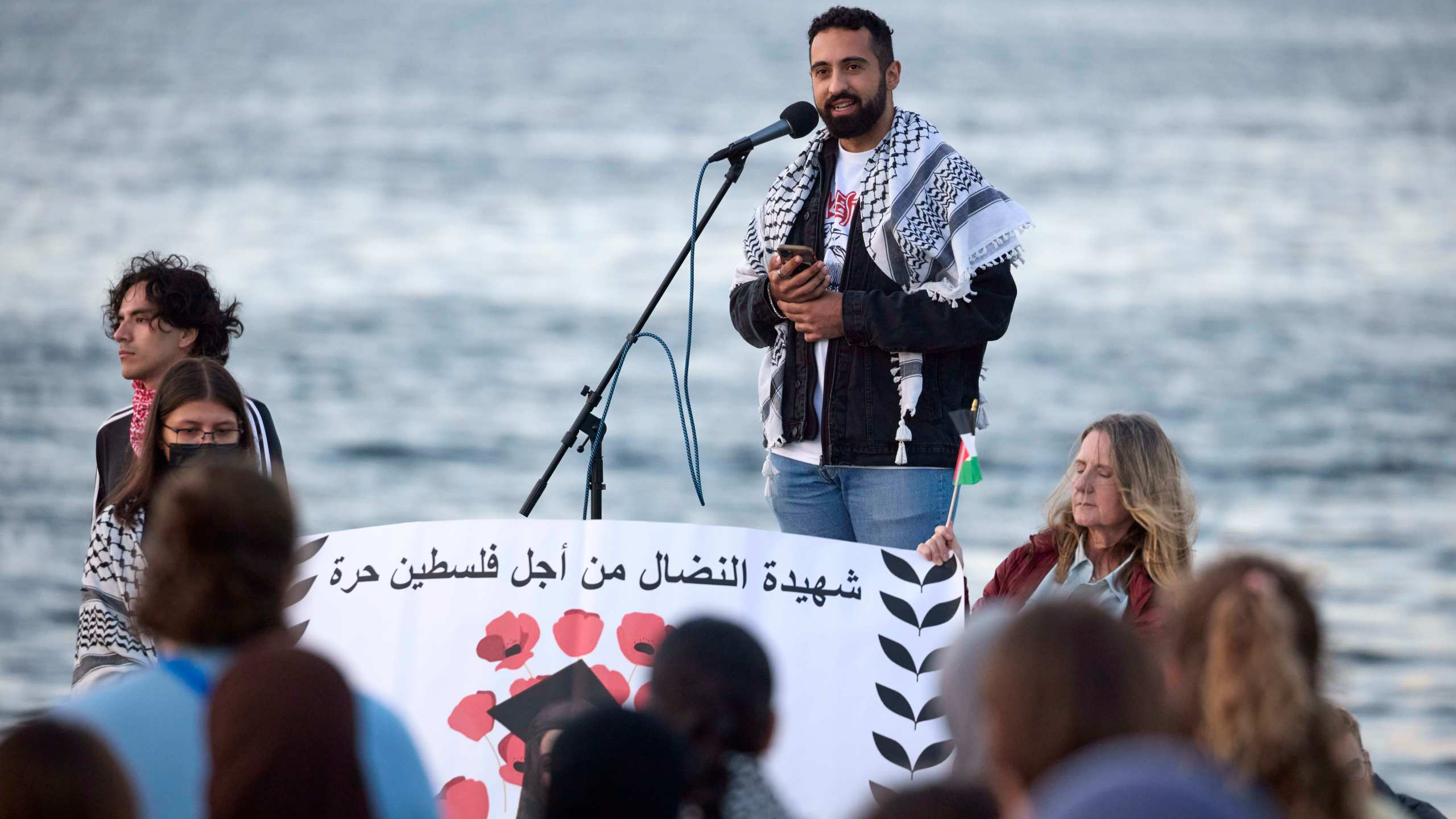 Yoseph Gazal, a friend of the 26-year old Aysenur Ezgi Eygi, killed recently in the occupied West Bank, during vigil on Alki Beach, Wednesday, Sept. 11, 2024, in Seattle. Eygi grew up in Seattle, attended Seattle Public Schools and graduated from the University of Washington. (AP Photo/John Froschauer)