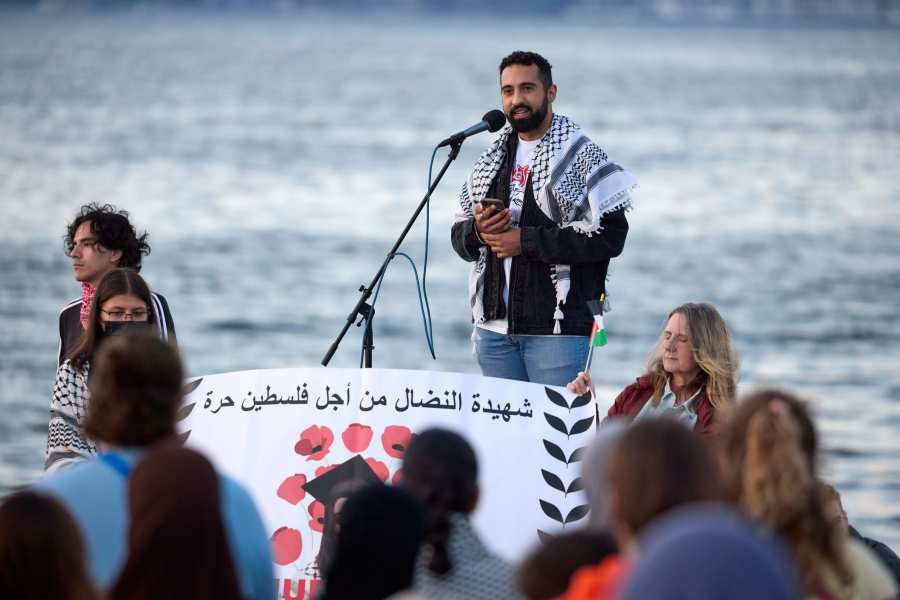 Yoseph Gazal, a friend of the 26-year old Aysenur Ezgi Eygi, killed recently in the occupied West Bank, during vigil on Alki Beach, Wednesday, Sept. 11, 2024, in Seattle. Eygi grew up in Seattle, attended Seattle Public Schools and graduated from the University of Washington. (AP Photo/John Froschauer)