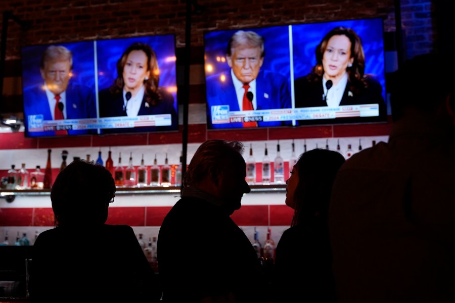 Viewers gather to watch a debate between Democratic presidential nominee Vice President Kamala Harris and Republican presidential nominee former President Donald Trump at the Angry Elephant Bar and Grill, Tuesday, Sept. 10, 2024, in San Antonio. (AP Photo/Eric Gay)