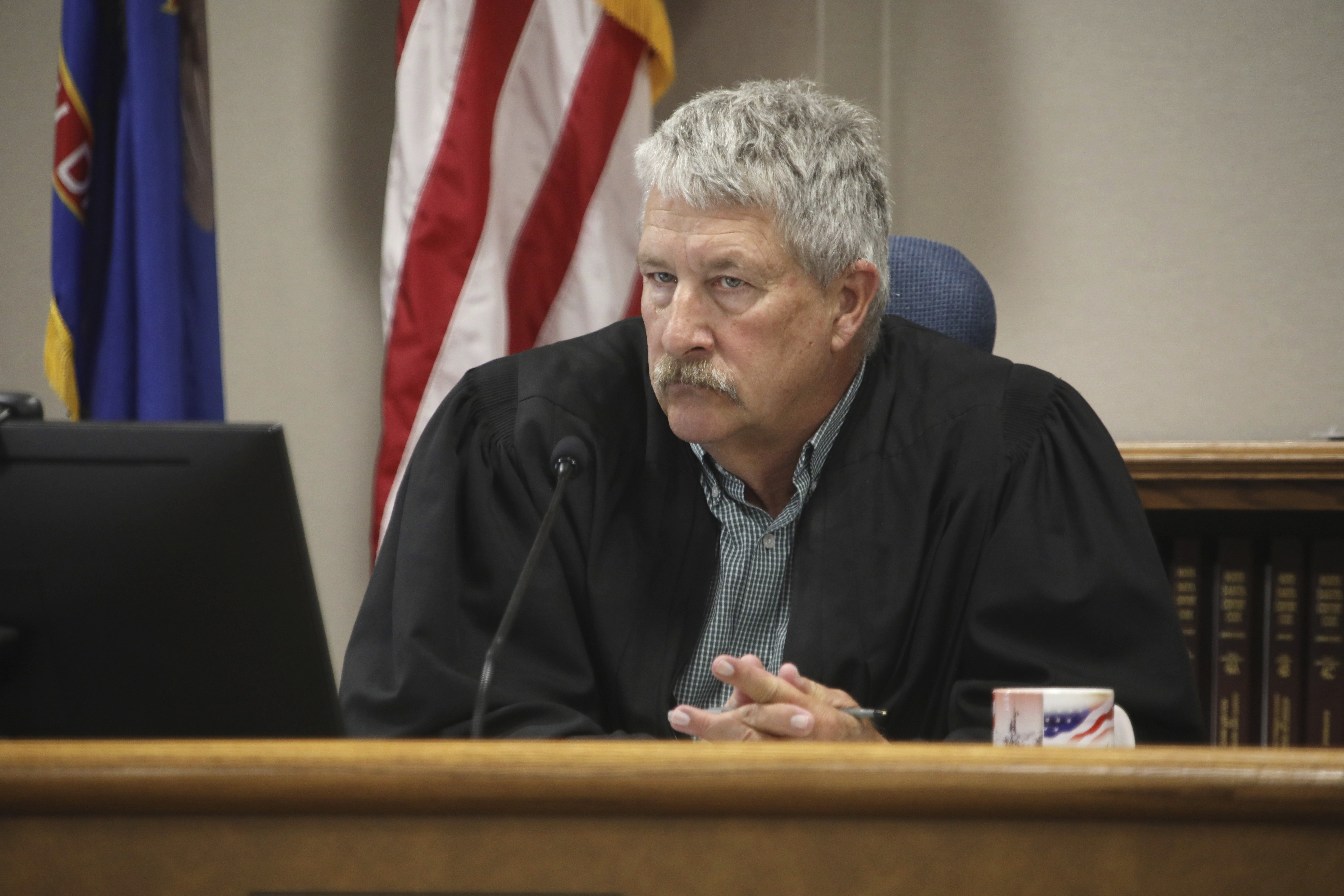 FILE - South Central District Judge Bruce Romanick listens to arguments by attorneys during a hearing challenging North Dakota's abortion laws, July 23, 2024, in Bismarck, N.D. (Brad Nygaard/The Bismarck Tribune via AP, File)