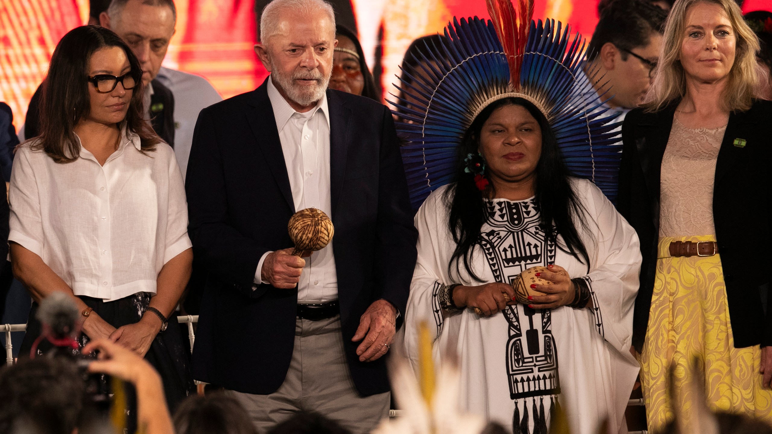 Brazil's President Luiz Inacio Lula da Silva, second from left, Minister for Indigenous Peoples Sonia Guajajara, second from right, and Denmark's Ambassador to Brazil Eva Bisgaard Pederson, right, attend a ceremony celebrating the return of the Indigenous Tupinamba people's sacred cloak to Brazil, in Rio de Janeiro, Thursday, Sept. 12, 2024. The garment, made from bird feathers and plant fibers, was repatriated to Brazil after having spent more than 300 years in the National Museum of Denmark. (AP Photo/Bruna Prado)