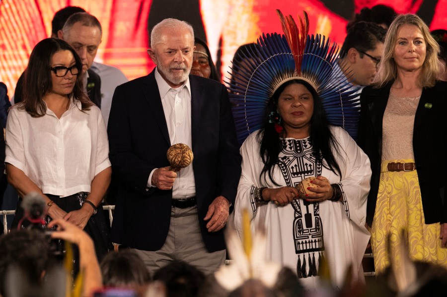 Brazil's President Luiz Inacio Lula da Silva, second from left, Minister for Indigenous Peoples Sonia Guajajara, second from right, and Denmark's Ambassador to Brazil Eva Bisgaard Pederson, right, attend a ceremony celebrating the return of the Indigenous Tupinamba people's sacred cloak to Brazil, in Rio de Janeiro, Thursday, Sept. 12, 2024. The garment, made from bird feathers and plant fibers, was repatriated to Brazil after having spent more than 300 years in the National Museum of Denmark. (AP Photo/Bruna Prado)