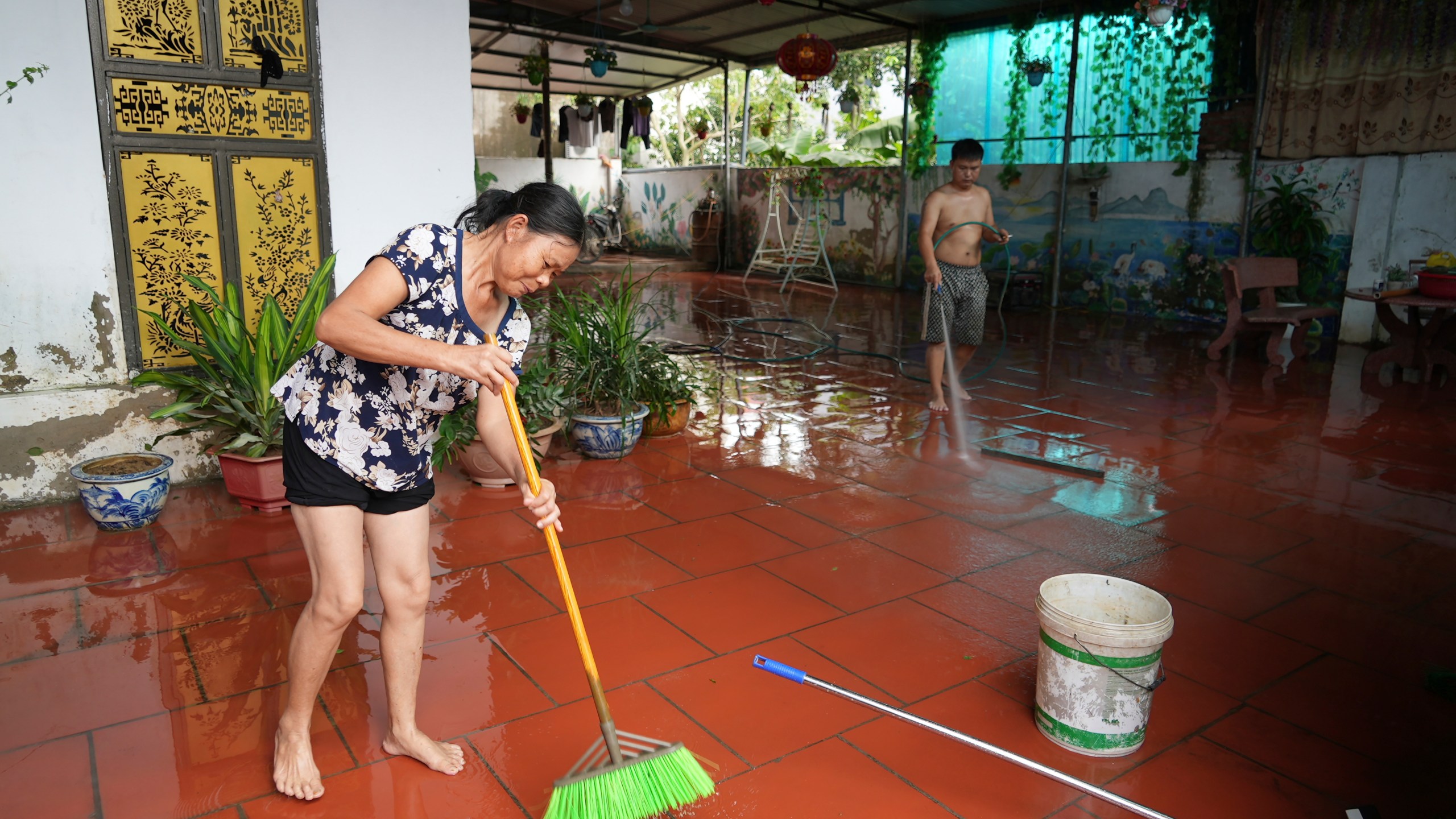 People clean their house after flood recedes in the aftermath of Typhoon Yagi in An Lac village, Hanoi, Vietnam Friday, Sept. 13, 2024. (AP Photo/Hau Dinh)