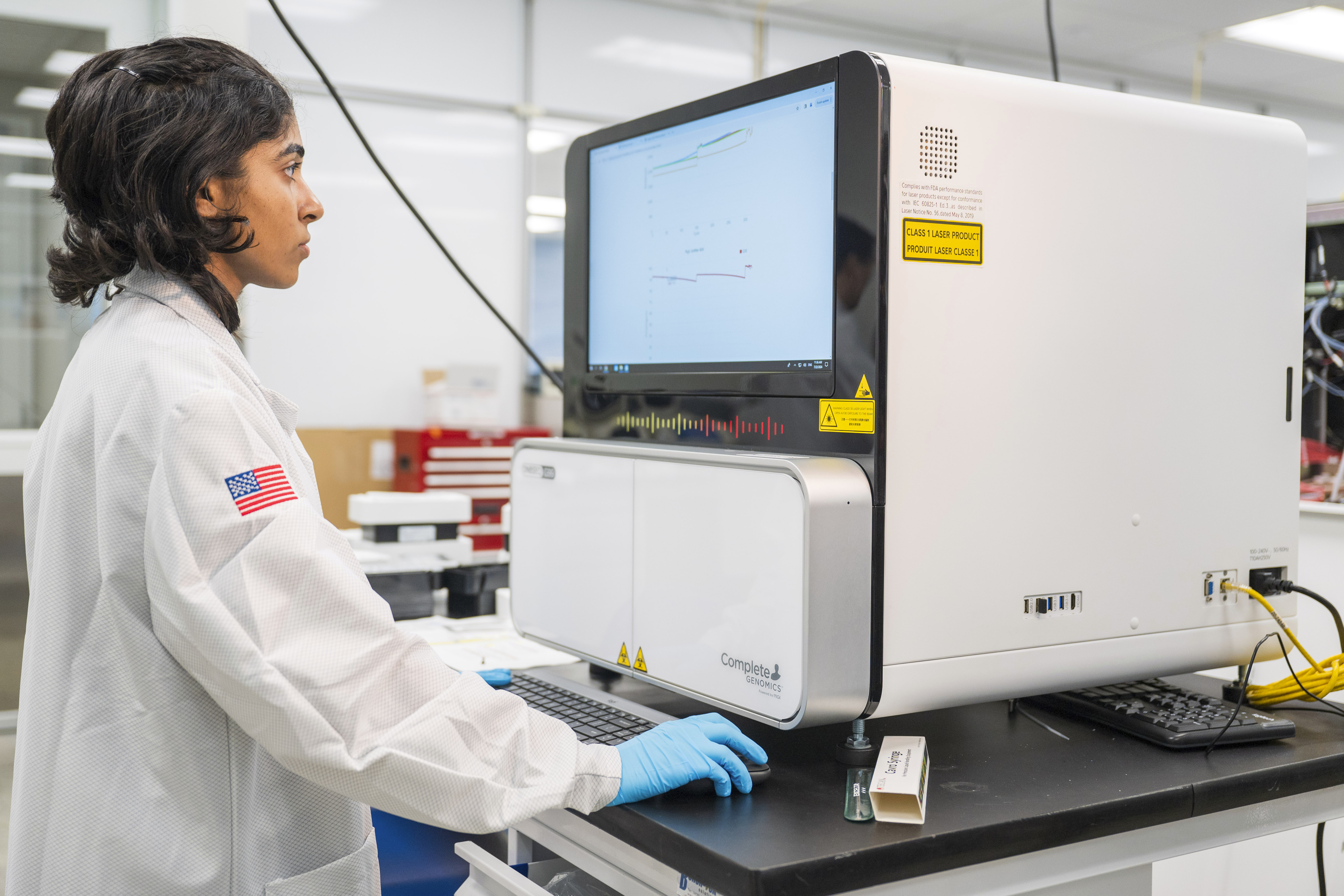 A lab technician works on a sequencer inside the quality control department at Complete Genomics in San Jose, Calif., Monday, July 22, 2024. (AP Photo/Nic Coury)