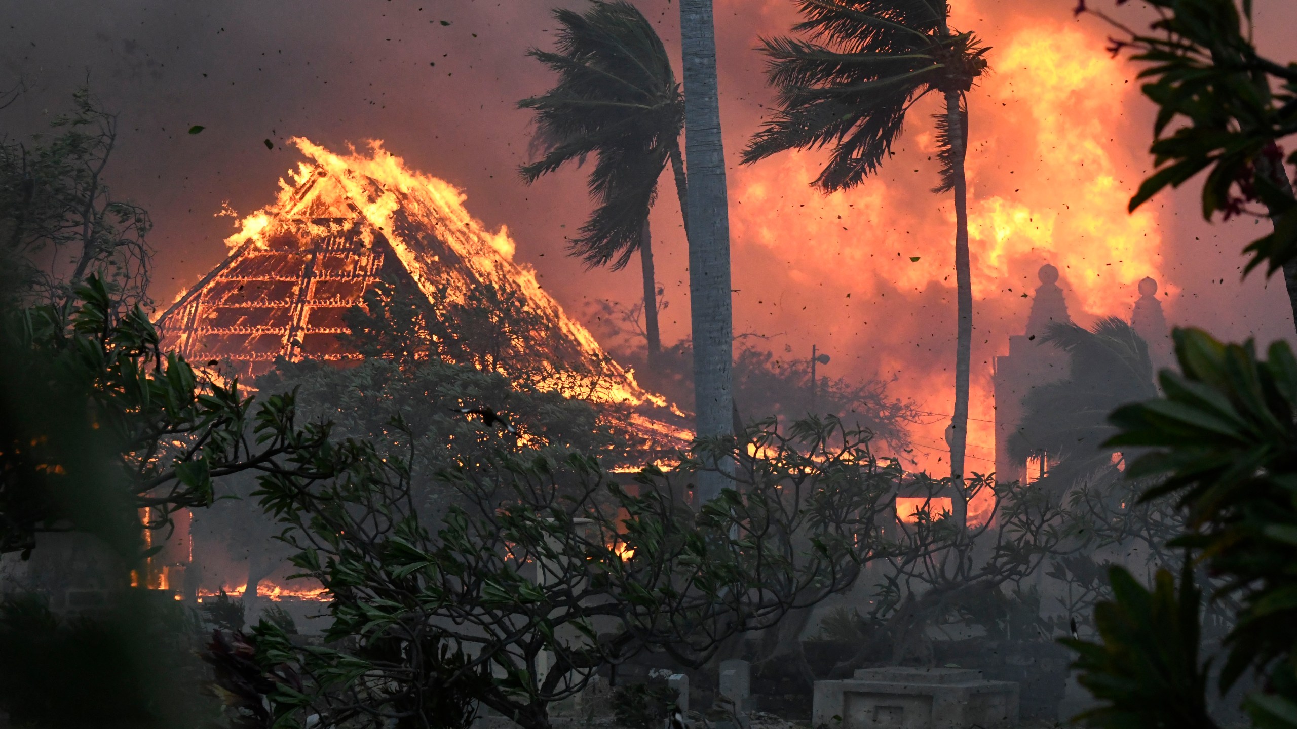 FILE - The hall of historic Waiola Church in Lahaina and nearby Lahaina Hongwanji Mission are engulfed in flames along Wainee Street on Aug. 8, 2023, in Lahaina, Hawaii. (Matthew Thayer/The Maui News via AP, File)