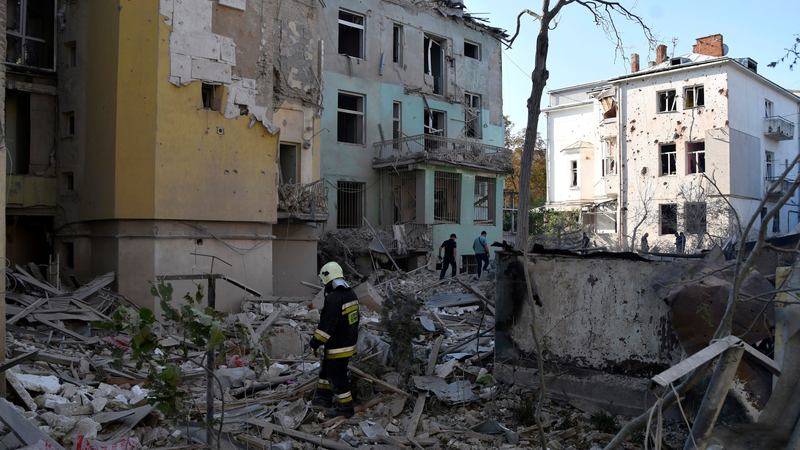 FILE - Rescuers search for victims in an apartment building destroyed by Russian missile attack in centre Lviv, Western Ukraine, Sept. 4, 2024. (AP Photo/Mykola Tys, File)