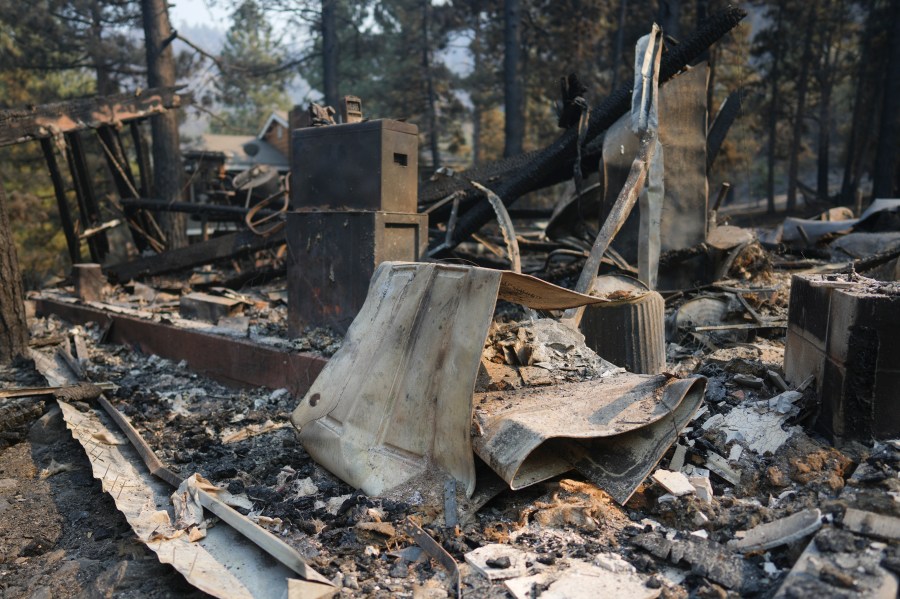 A fire-ravaged property is seen after the Bridge Fire swept through, Thursday, Sept. 12, 2024, in Wrightwood, Calif. (AP Photo/Eric Thayer)