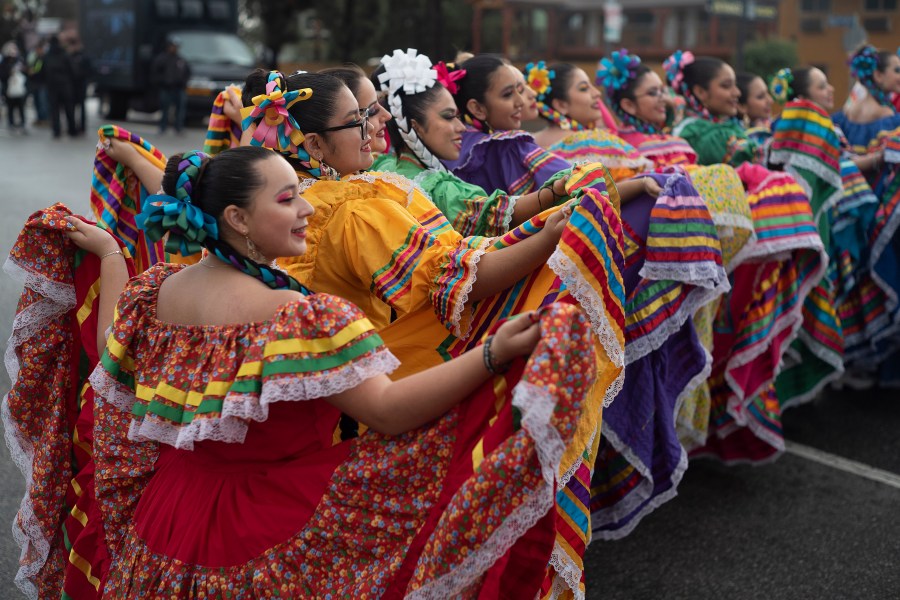 FILE - Members of the Cathedral City High School Ballet Folklorico pose for photo prior to joining in the Kingdom Day Parade in Los Angeles, Jan. 16, 2023. (AP Photo/Richard Vogel, File)