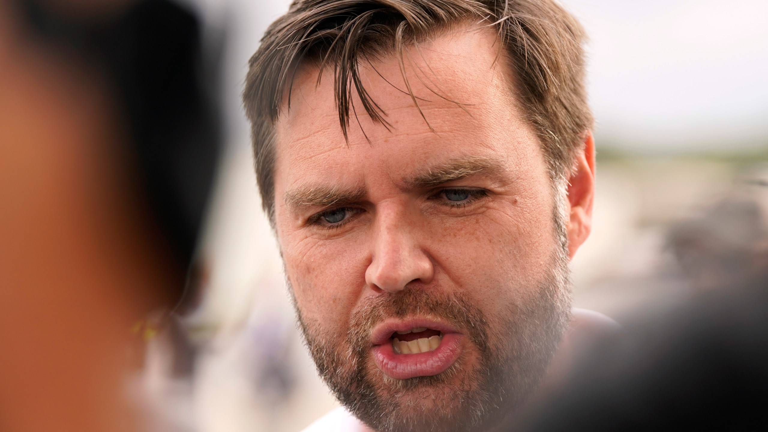 Republican vice presidential nominee Sen. JD Vance, R-Ohio, speaks to reporters before he departs Pitt-Greenville Airport following a campaign event in Greenville, N.C., Saturday Sept. 14, 2024. (AP Photo/Steve Helber)