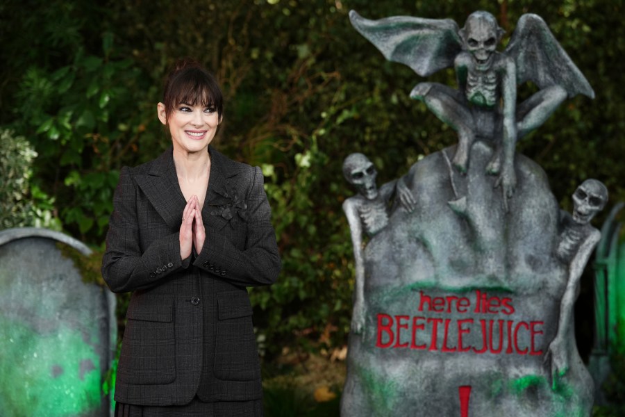 Winona Ryder poses for photographers upon arrival at the photo call for the film "Beetlejuice Beetlejuice" on Friday, Aug. 30, 2024, in London. (Photo by Scott A Garfitt/Invision/AP)