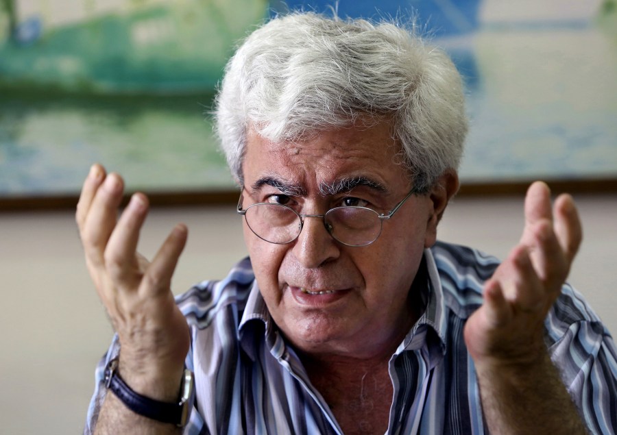 FILE - Lebanese prominent writer and intellectual Elias Khoury speaks during an interview with The Associated Press at his office in the Institute for Palestine Studies in Beirut, Lebanon, Friday, Aug. 8, 2014. (AP Photo/Bilal Hussein, File)