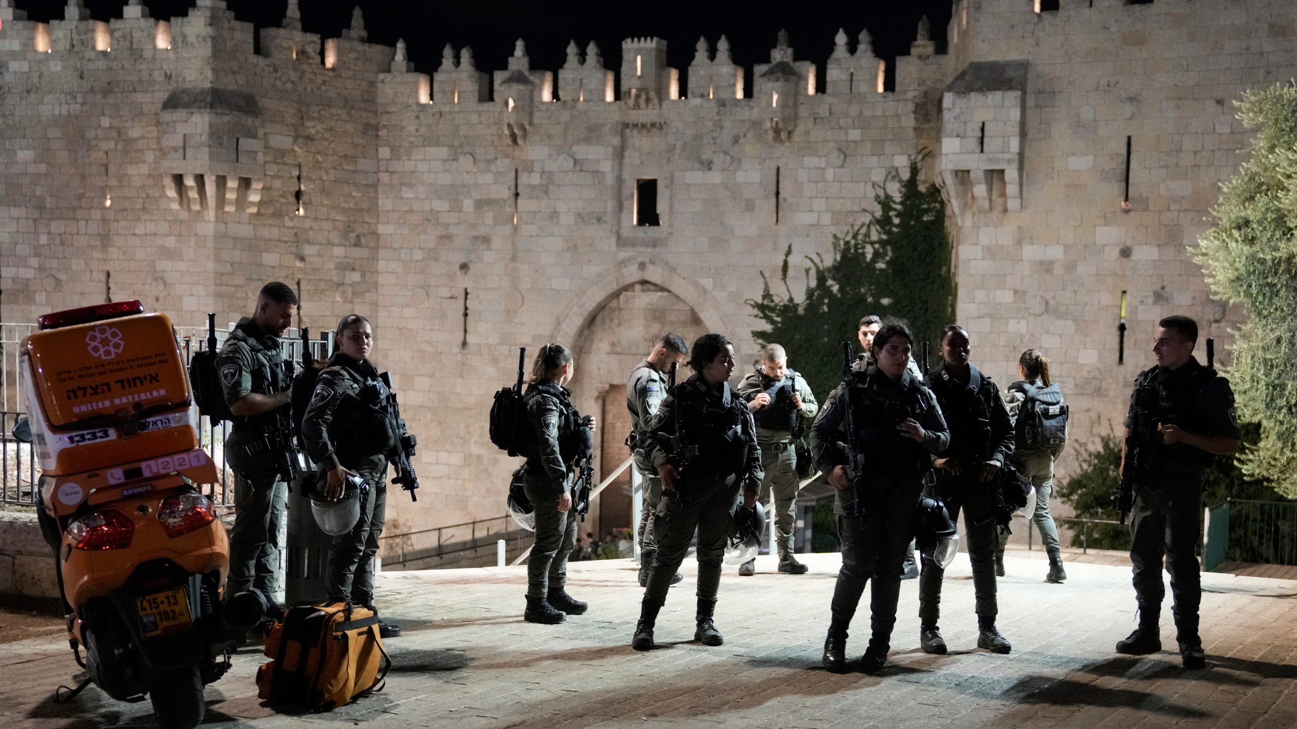 Israeli security forces stand guard near the scene of a stabbing attack at Damascus Gate in Jerusalem's Old City, Sunday, Sept. 15, 2024. (AP Photo/Mahmoud Illean)