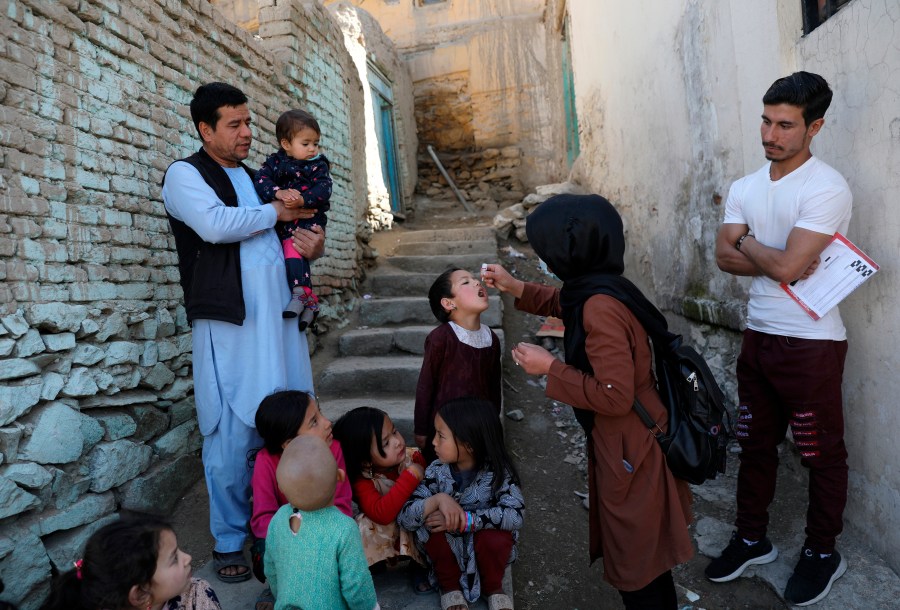 FILE - Shabana Maani, gives a polio vaccination to a child in the old part of Kabul, Afghanistan, Monday, March 29, 2021. (AP Photo/Rahmat Gul, File)