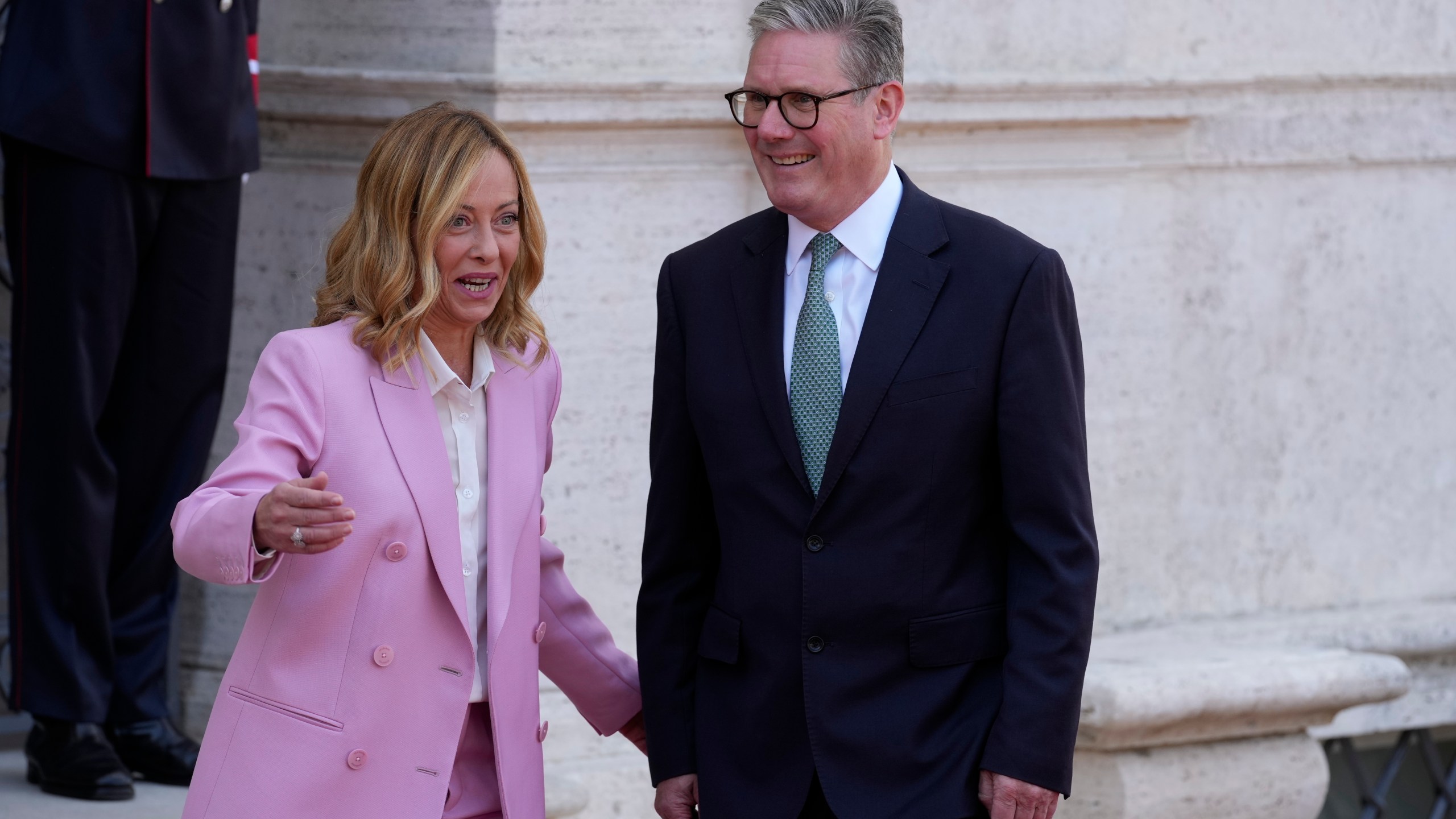 Italian Premier Giorgia Meloni, left, welcomes U.K. Prime Minister Keir Starmer as they meet at Villa Panphilj in Rome, Monday, Sept. 16, 2024. U.K. Prime Minister Keir Starmer is meeting Italian Premier Giorgia Meloni in Rome on Monday, as the two very different politicians, from left and right, seek common cause to curb migrants reaching their shores by boat. The visit comes after at least eight seaborne migrants died off the French coast over the weekend. (AP Photo Andrew Medichini)