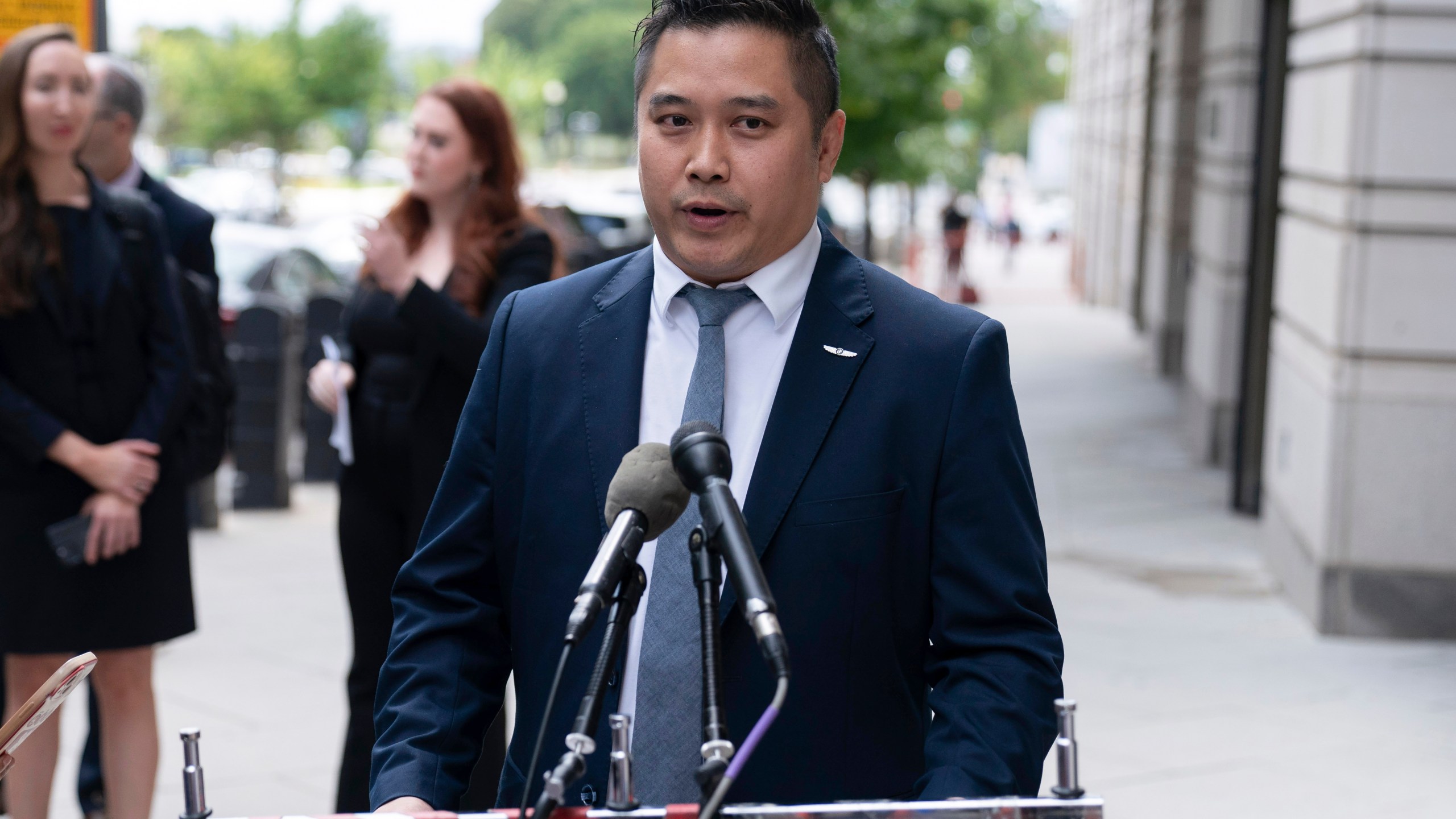 TikTok content creator Paul Tran talks to the press as he leaves the federal courthouse in Washington, Monday, Sept. 16, 2024, after a hearing on TikTok's lawsuit against the federal government. (AP Photo/Jose Luis Magana)