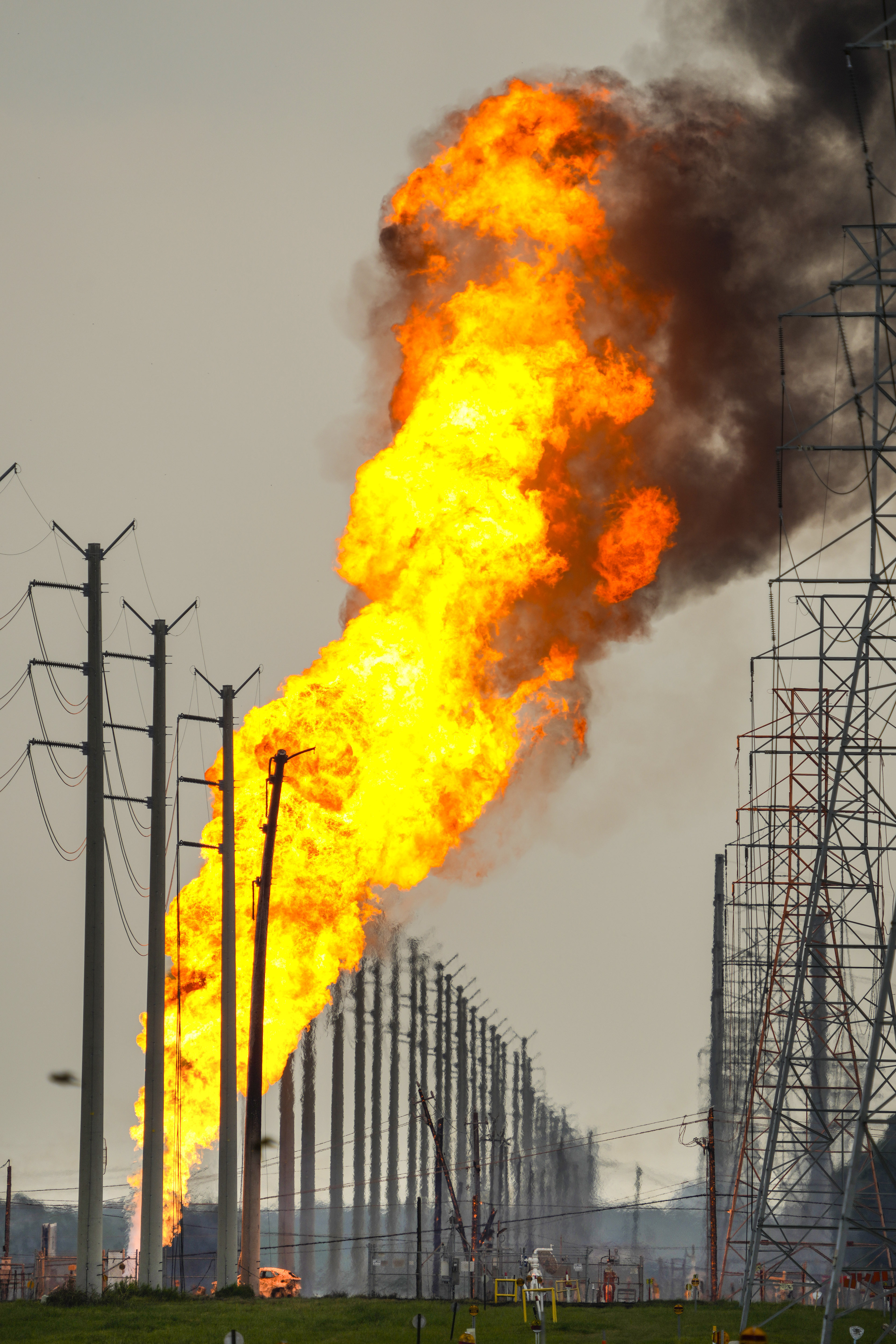 A pipeline carrying liquified natural gas burns near Spencer Highway and Summerton on Monday, Sept. 16, 2024, in La Porte, Texas. (Brett Coomer/Houston Chronicle via AP)