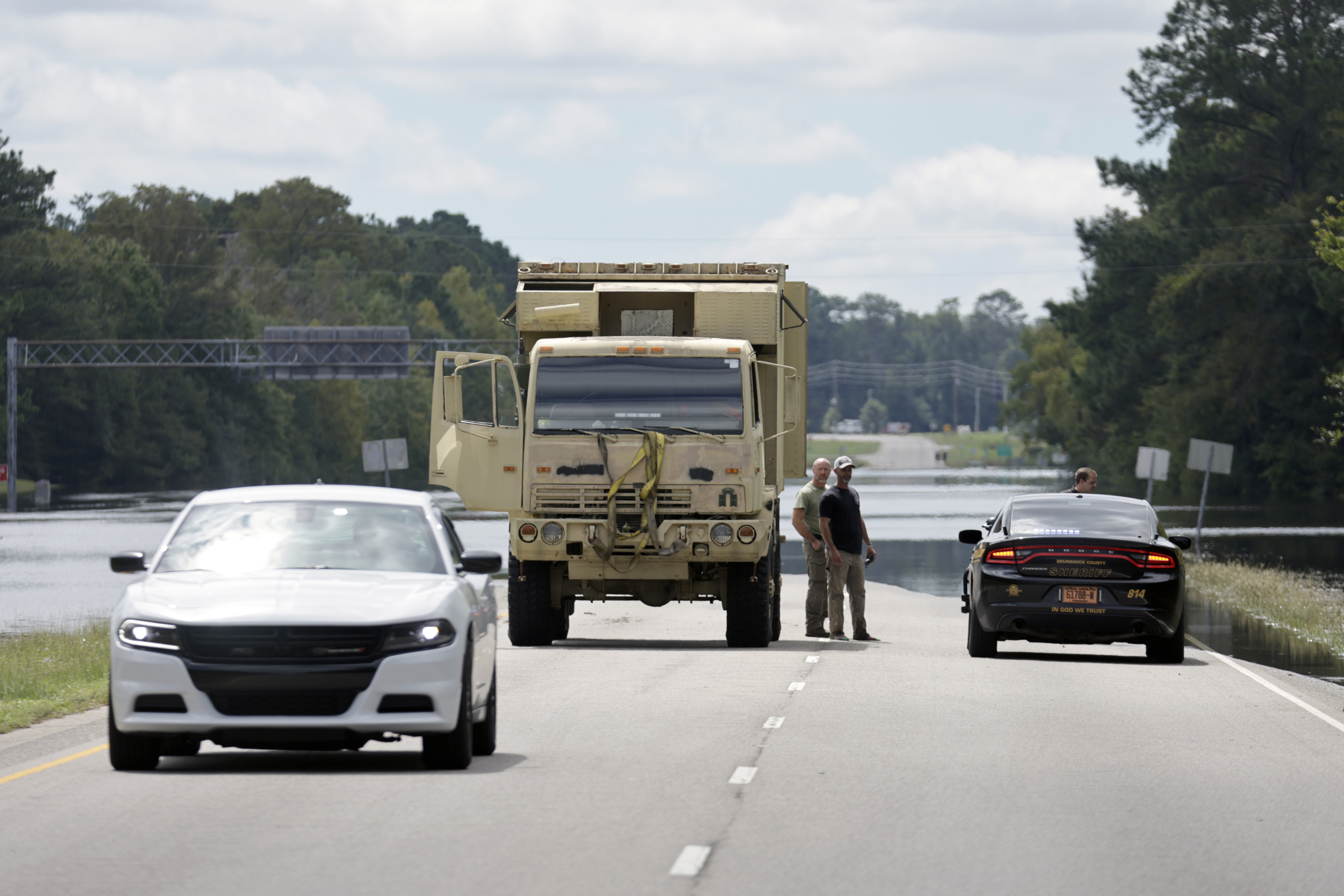 Flooding from heavy rains closed U.S Highway 17 near Winnabow, south of Wilmington, N.C., on Tuesday, Sept.17, 2024. (AP Photo/Chris Seward)