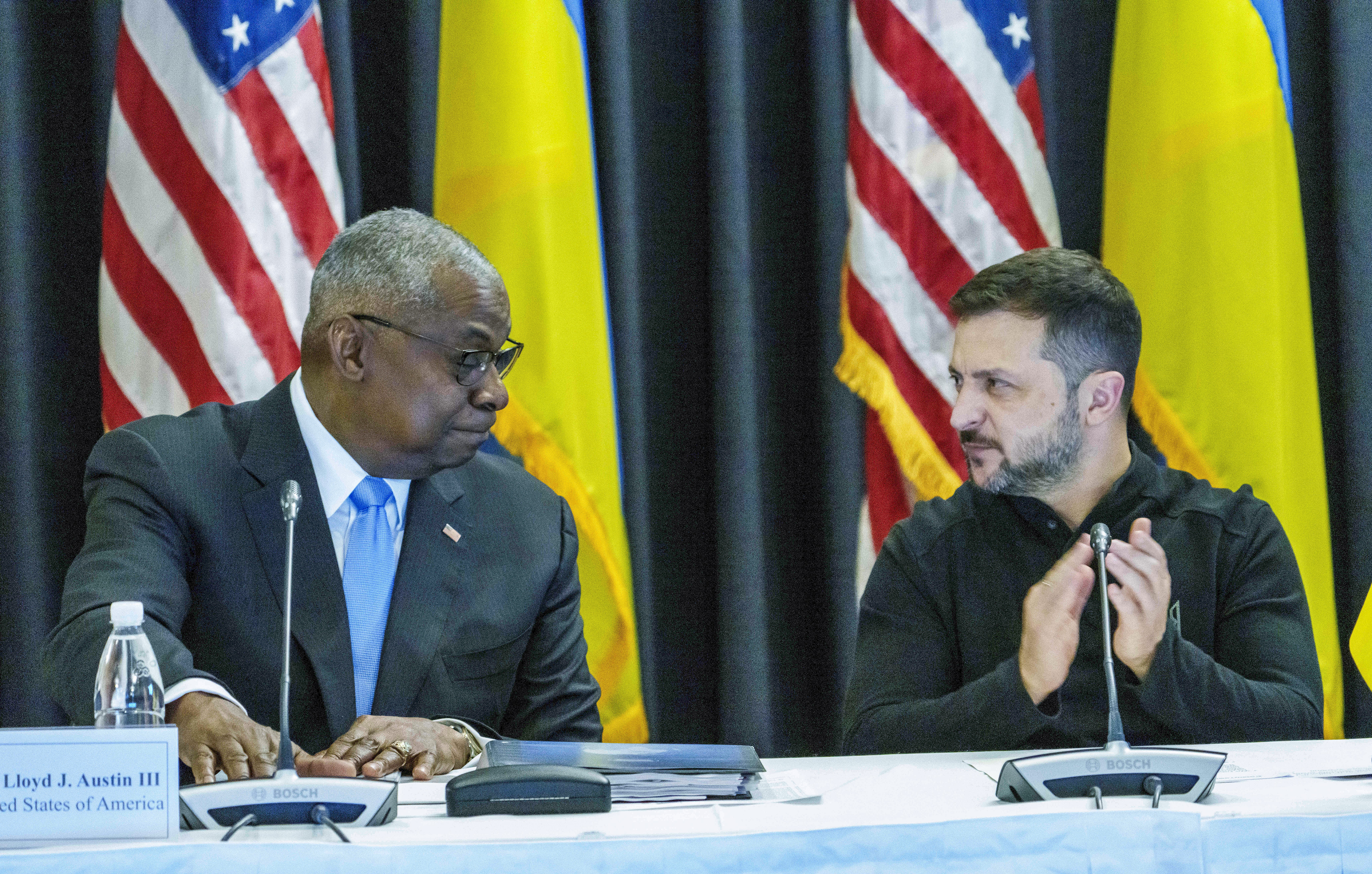 Defense Secretary Lloyd Austin, left and Ukrainian President Volodymyr Zelenskyy look at each other during the Ukraine Contact Group meeting at Ramstein Air Base, Friday, Sept.6, 2024. (Andreas Arnold/dpa via AP)