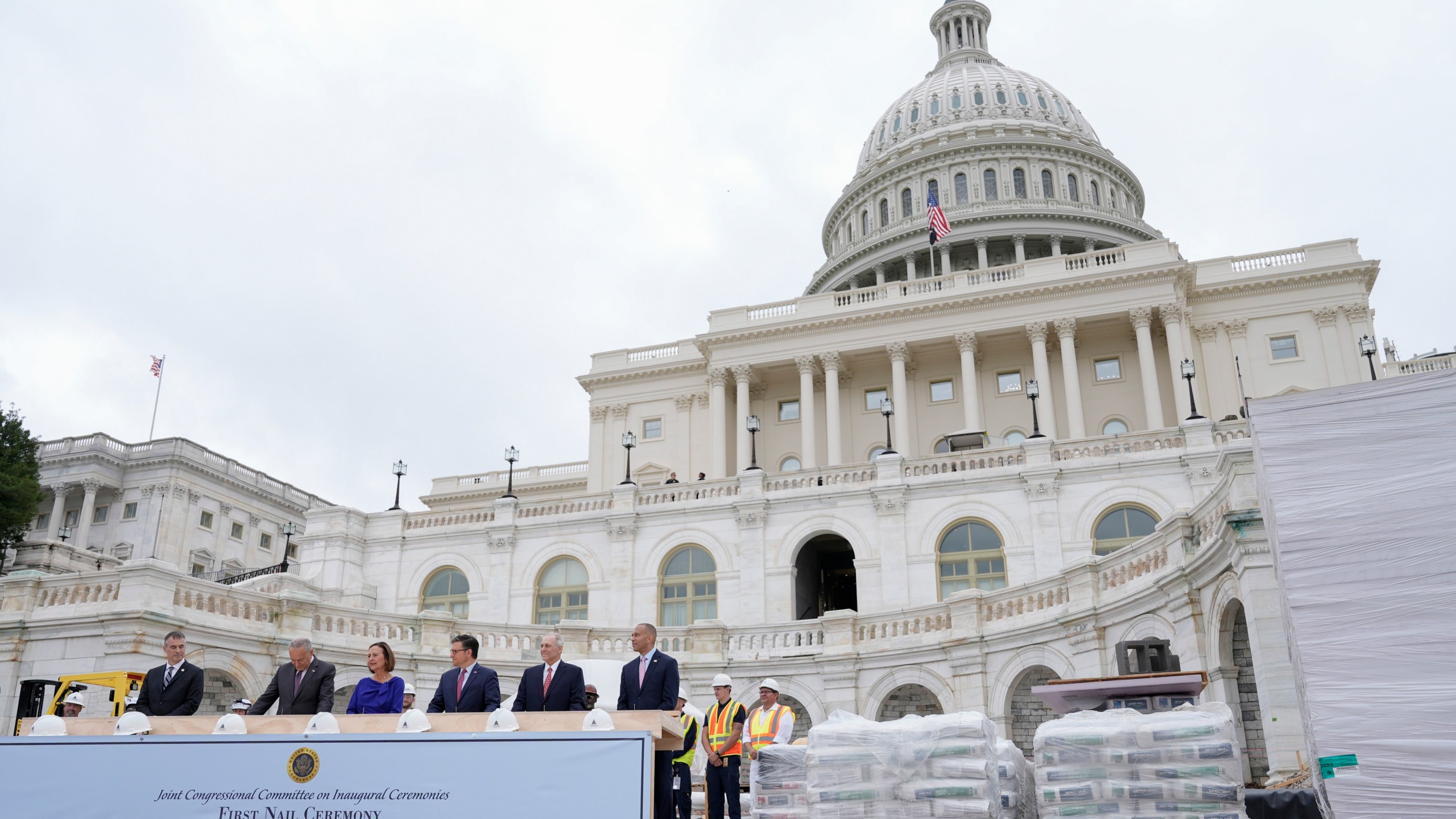 Congress members hammer in the first nails at the First Nail Ceremony marking the beginning of construction of the 2025 Presidential Inauguration platform on the steps of the Capitol, Wednesday, Sept. 18, 2024, in Washington. (AP Photo/Mariam Zuhaib)