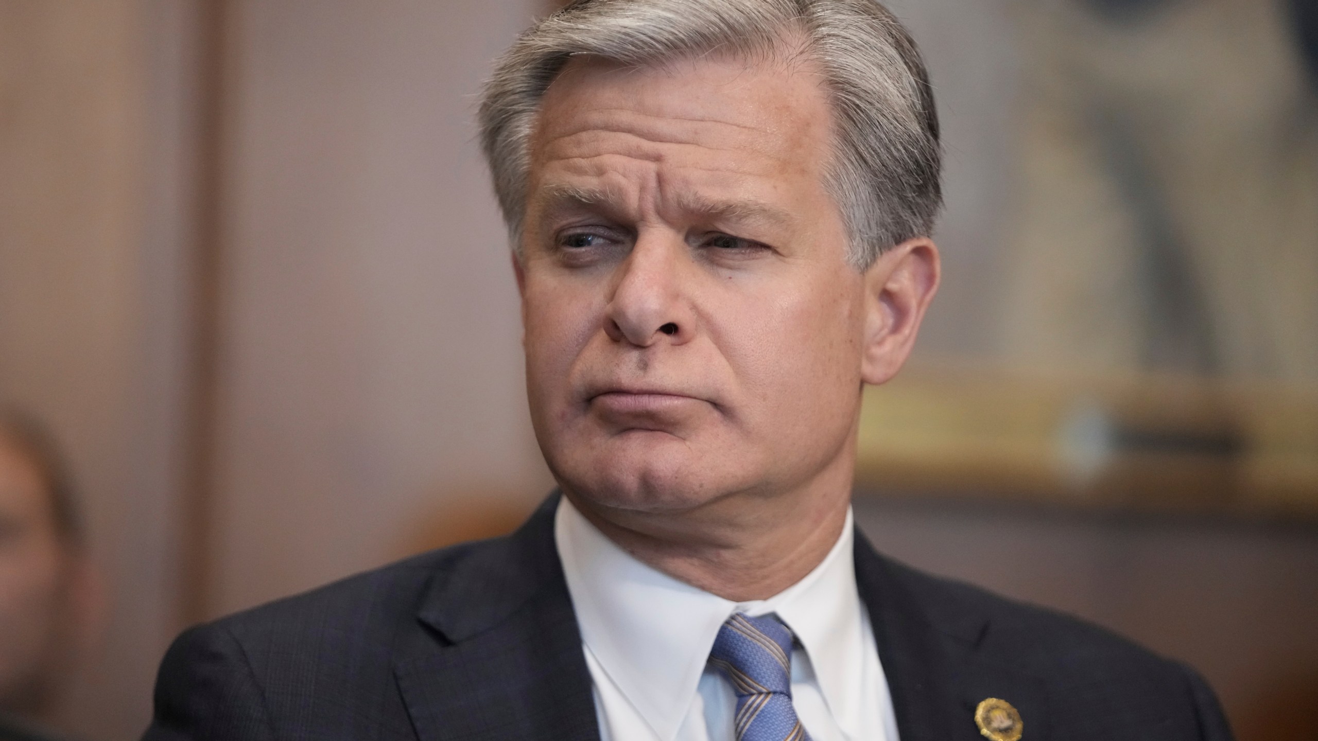 FBI Director Christopher Wray listens during a meeting of the Justice Department's Election Threats Task Force at the Department of Justice, Wednesday, Sept. 4, 2024, in Washington. (AP Photo/Mark Schiefelbein)