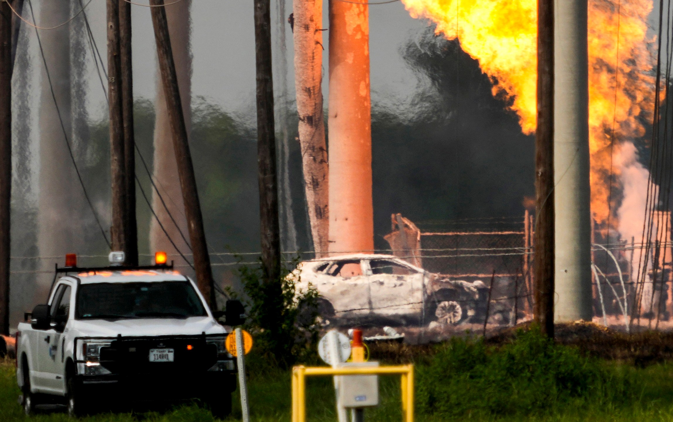 FILE - A massive pipeline fire burns after a vehicle drove through a fence along a parking lot and struck an above-ground valve near Spencer Highway and Summerton on Monday, Sept. 16, 2024, in La Porte, Texas. (Brett Coomer/Houston Chronicle via AP)