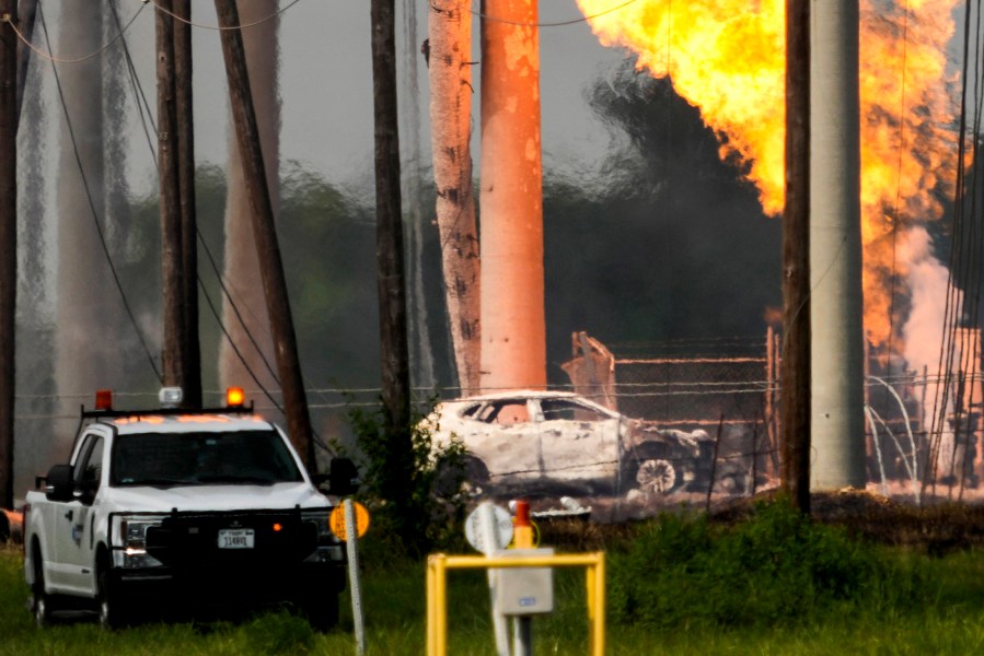 FILE - A massive pipeline fire burns after a vehicle drove through a fence along a parking lot and struck an above-ground valve near Spencer Highway and Summerton on Monday, Sept. 16, 2024, in La Porte, Texas. (Brett Coomer/Houston Chronicle via AP)