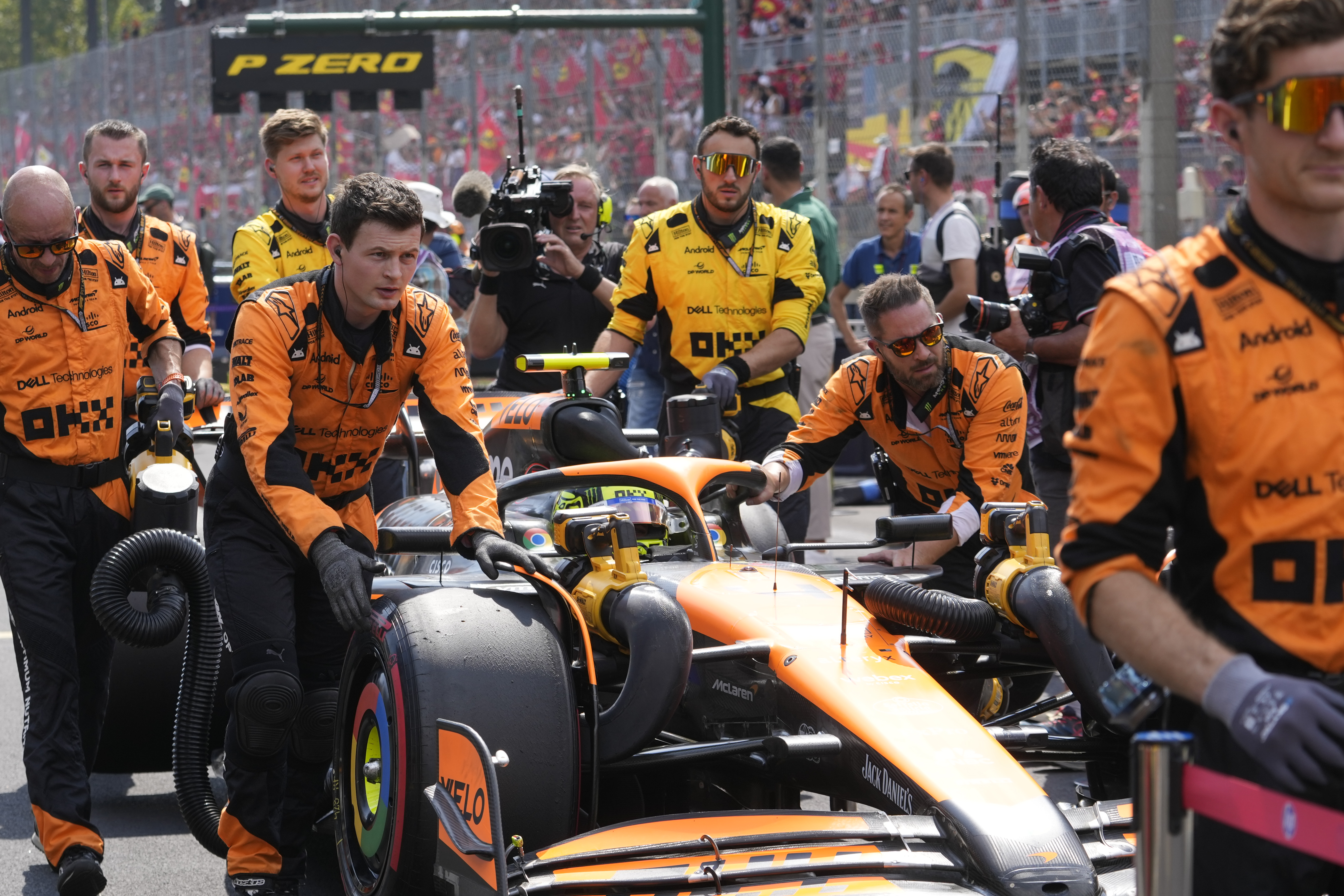 McLaren driver Lando Norris of Britain is pushed to the starting grid before the Formula One Italian Grand Prix race at the Monza racetrack, in Monza, Italy, Sunday, Sept. 1, 2024. (AP Photo/Luca Bruno)