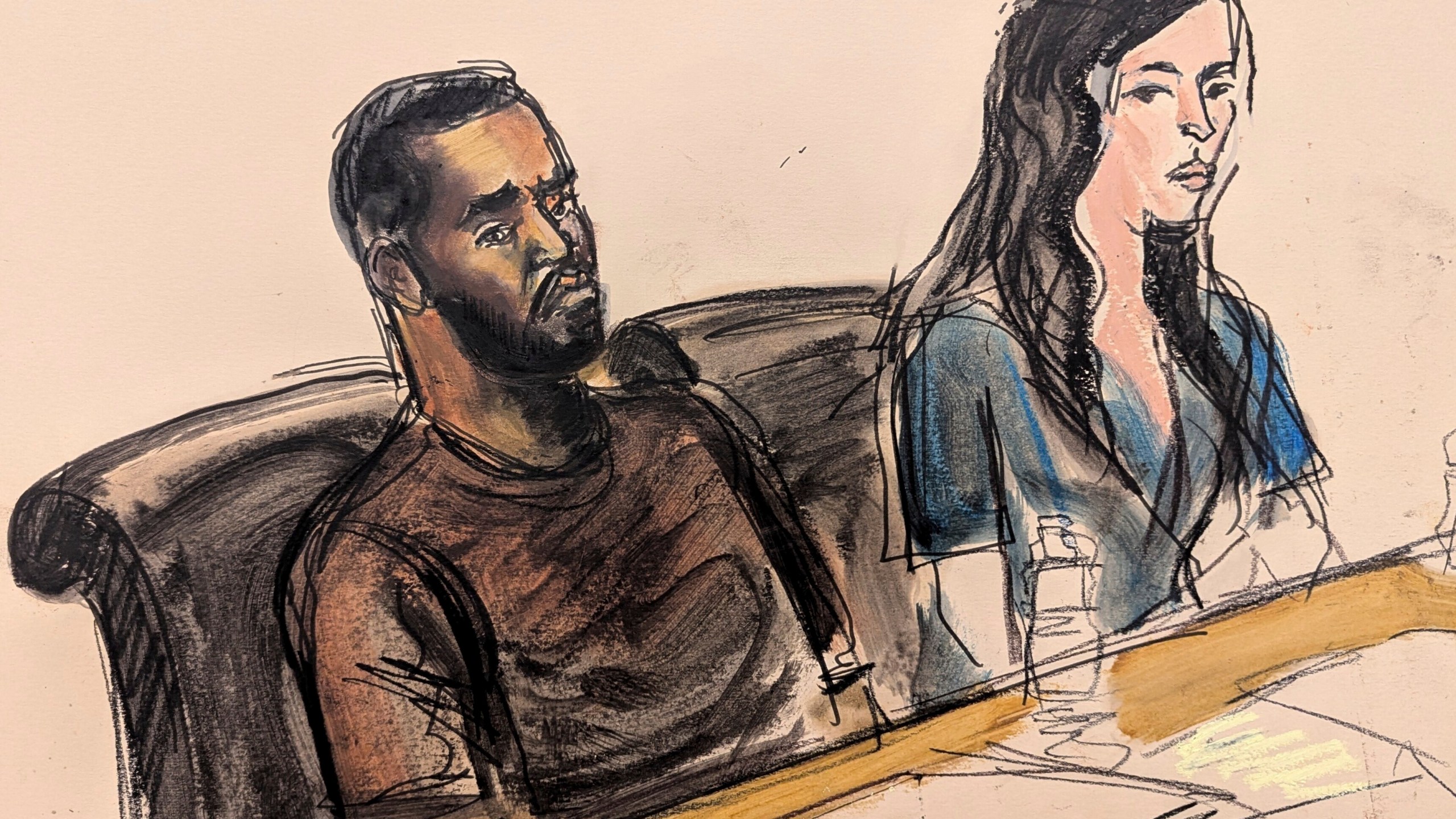 Depicted in this courtroom sketch, Sean "Diddy" Combs, left, sits at the defense table with one of his attorneys, Teny Garagos, during his bail hearing, Wednesday, Sept. 18, 2024, in New York. (Elizabeth Williams via AP)